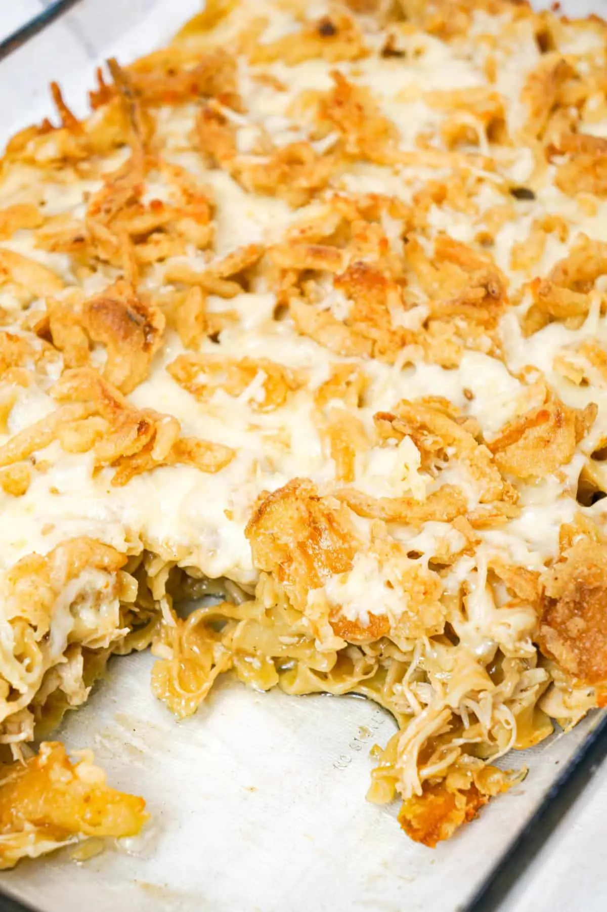 French Onion Chicken Casserole is a hearty casserole recipe loaded with shredded chicken, egg noodles, onion soup mix, cream of chicken soup, mozzarella cheese, parmesan cheese and French's crispy fried onions.