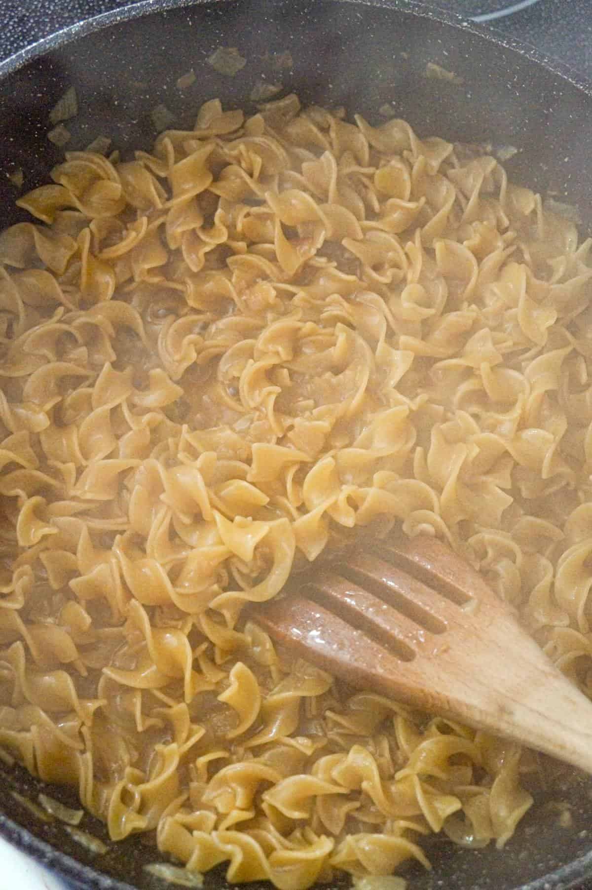egg noodles cooking in a pot