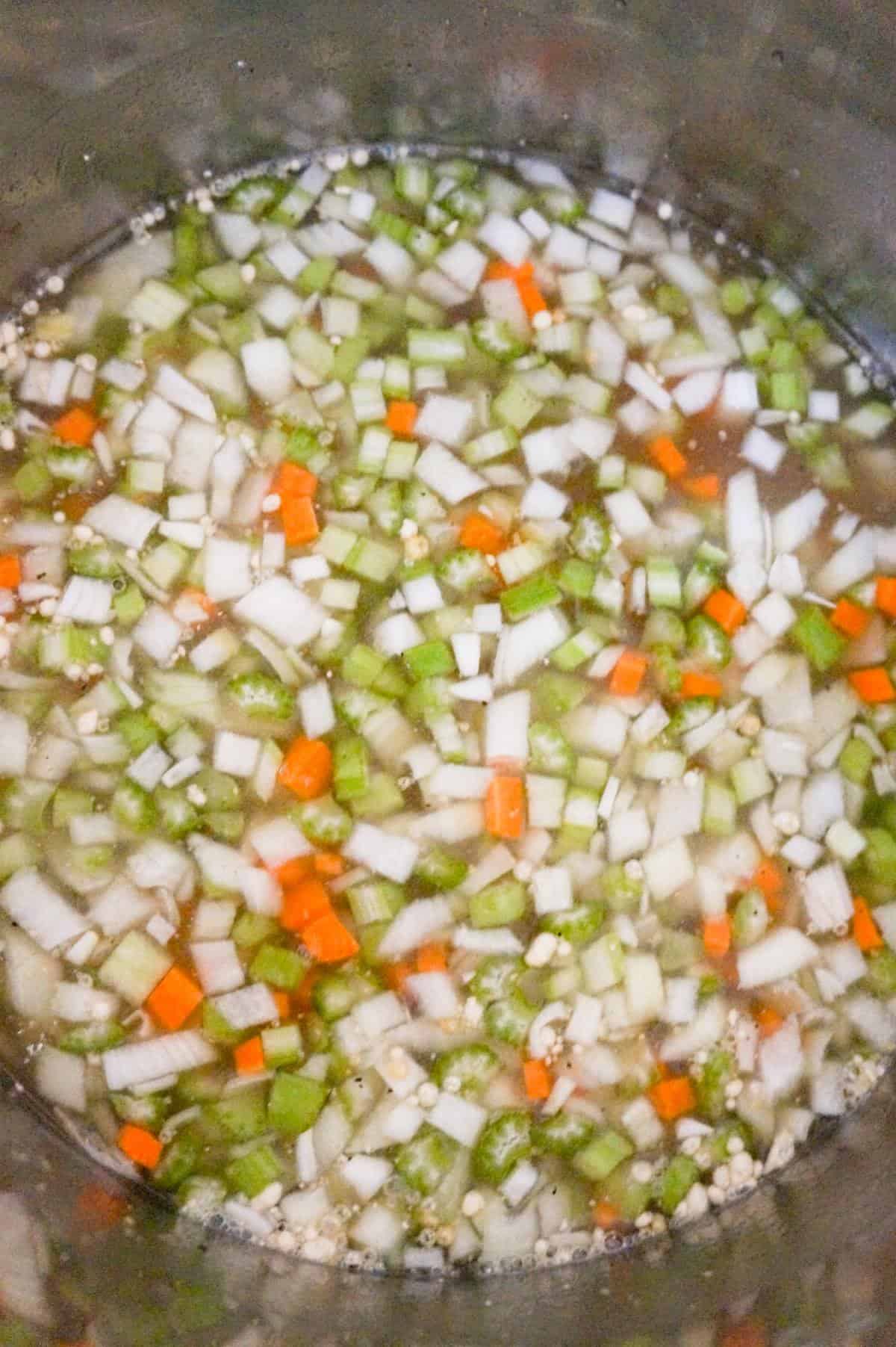 diced vegetables and broth in an Instant Pot