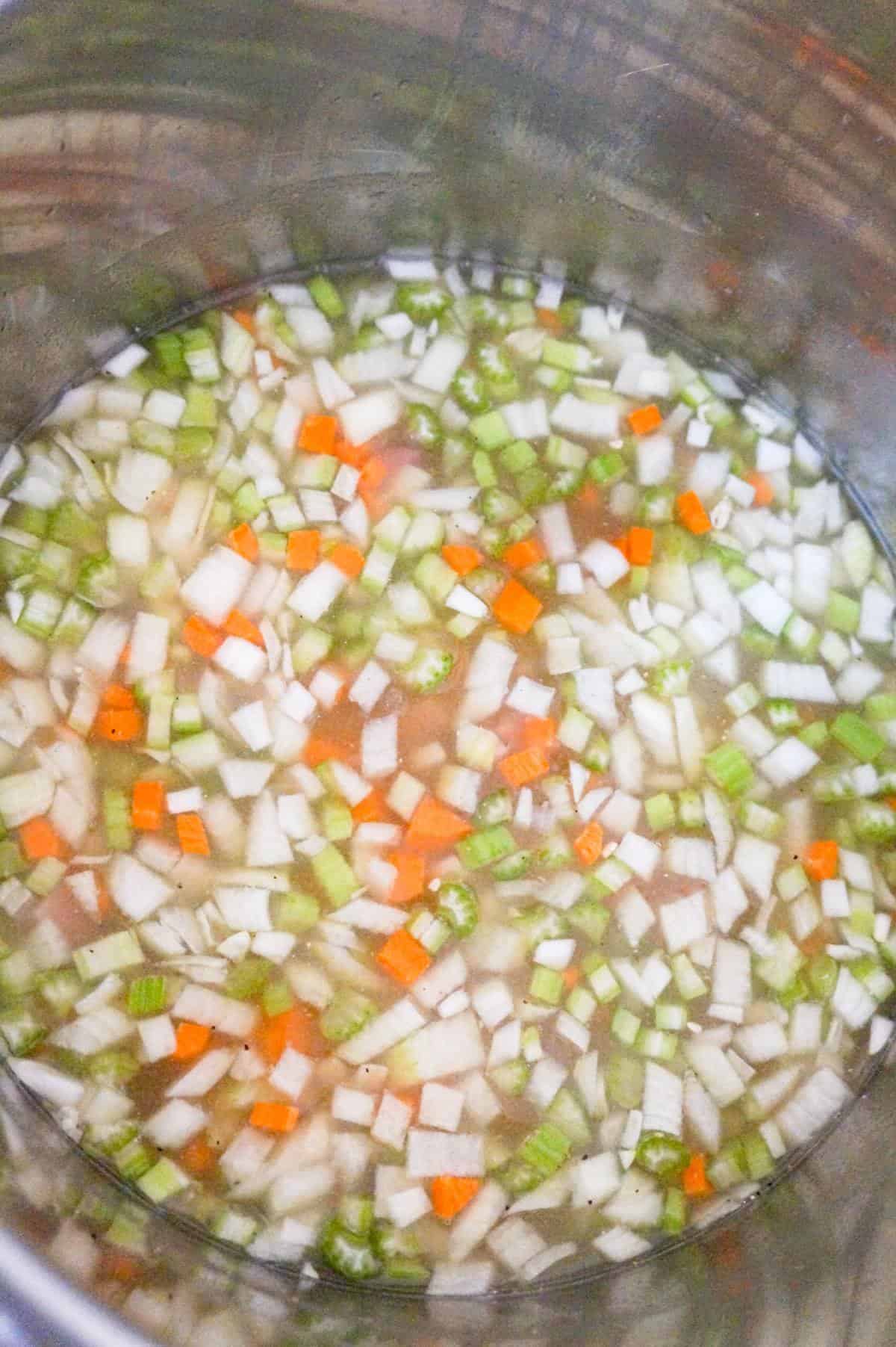 diced vegetables in broth in an Instant Pot