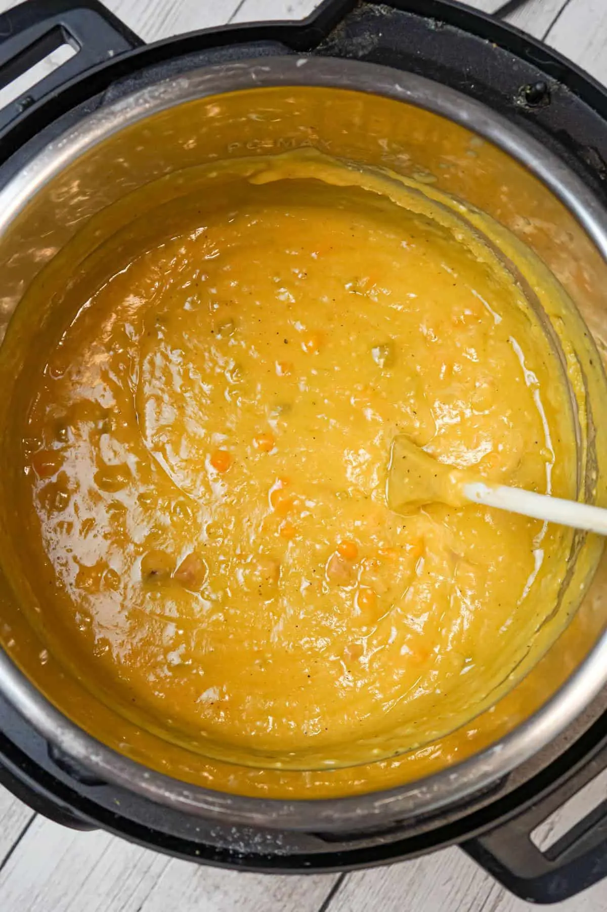 Instant Pot Split Pea Soup is a hearty pressure cooker soup recipe made with yellow split peas and loaded with diced ham, carrots and celery.