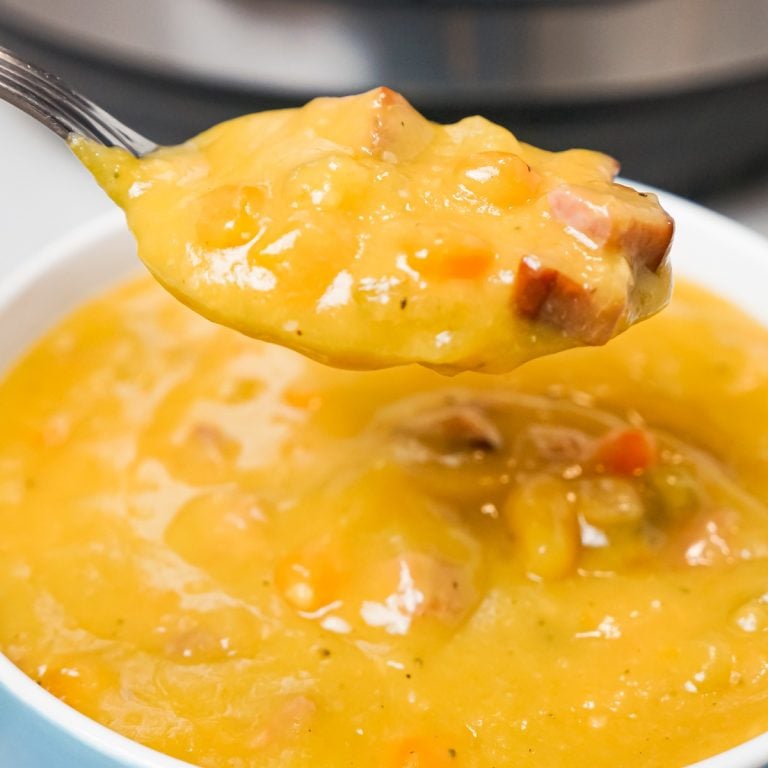 Instant Pot Split Pea Soup is a hearty pressure cooker soup recipe made with yellow split peas and loaded with diced ham, carrots and celery.