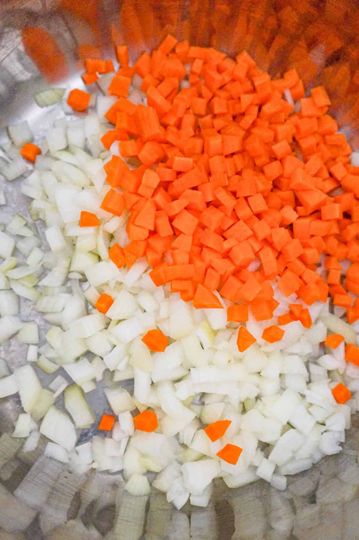 diced onion and diced carrot in an Instant Pot