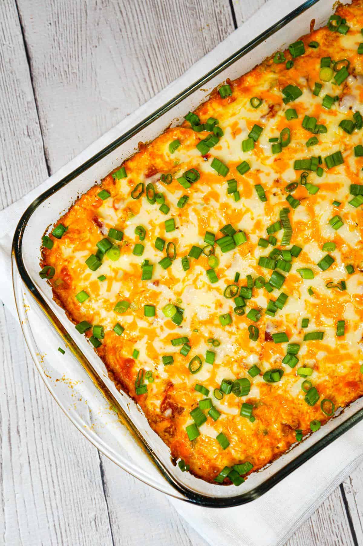 Mexican Chicken Casserole is an easy dinner recipe loaded with Minute rice, shredded rotisserie chicken, Rotel diced tomatoes and green chilies, sour cream and shredded cheese.