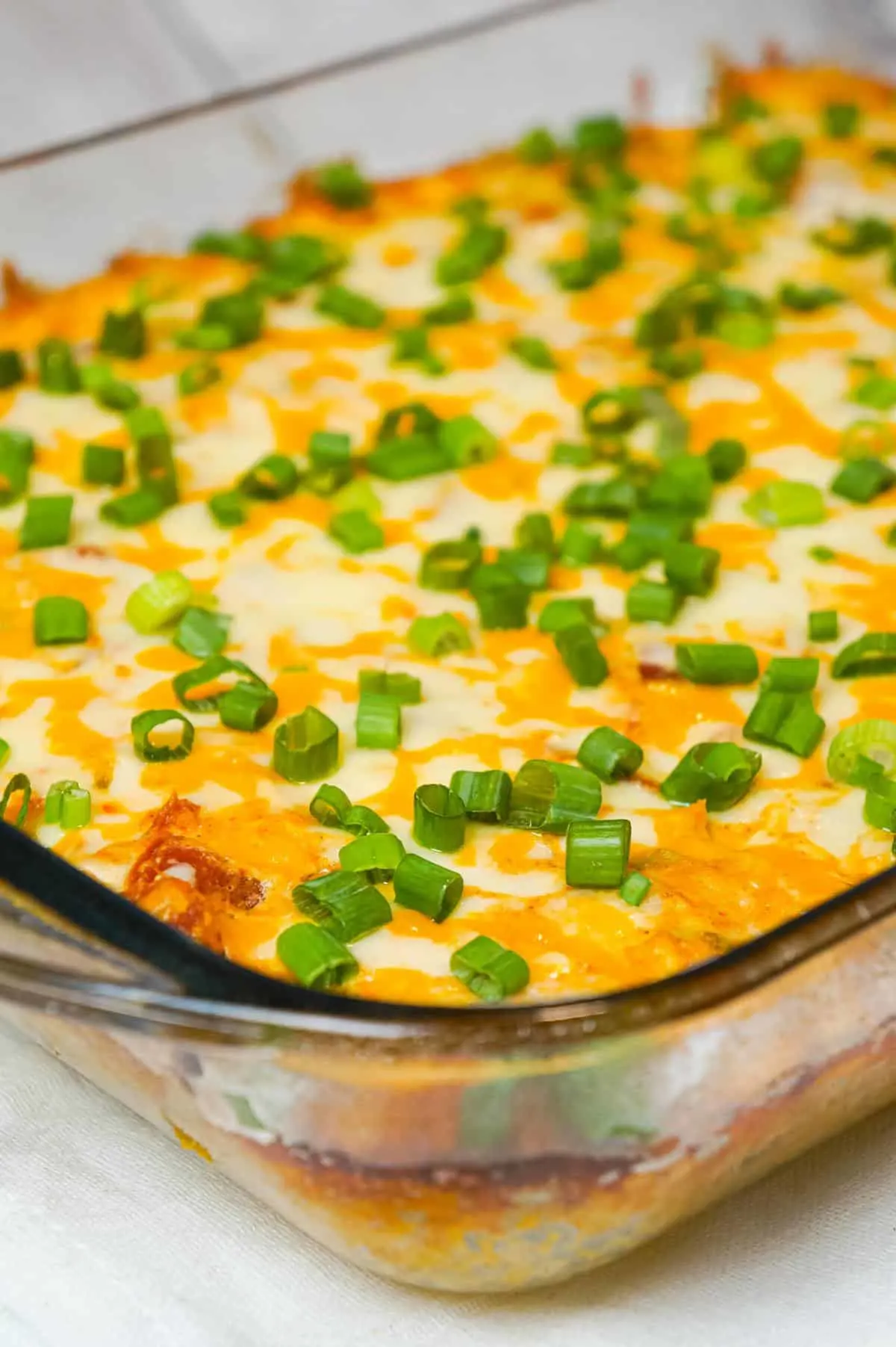 Mexican Chicken Casserole is an easy dinner recipe loaded with Minute rice, shredded rotisserie chicken, Rotel diced tomatoes and green chilies, sour cream and shredded cheese.