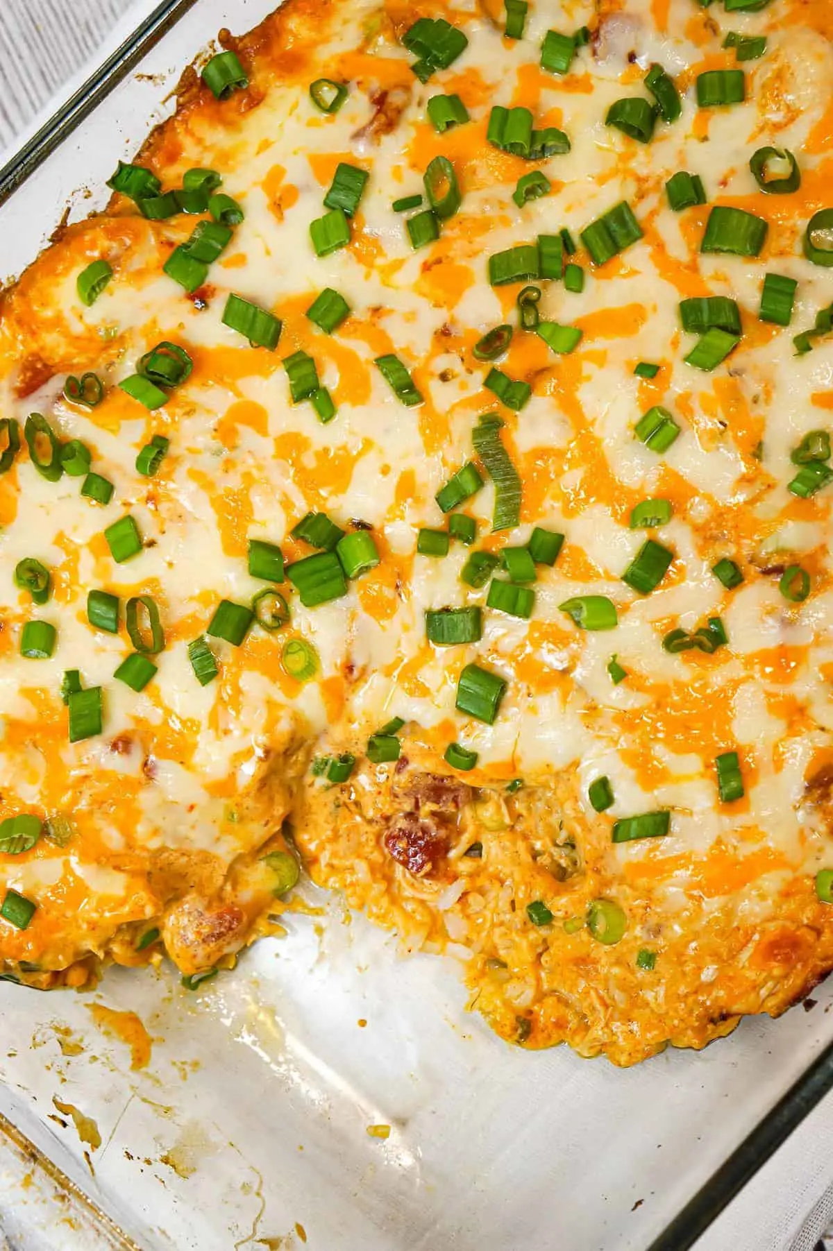 Mexican Chicken Casserole is an easy dinner recipe loaded with Minute rice, shredded rotisserie chicken, Rotel diced tomatoes and green chilies, sour cream and shredded cheese.