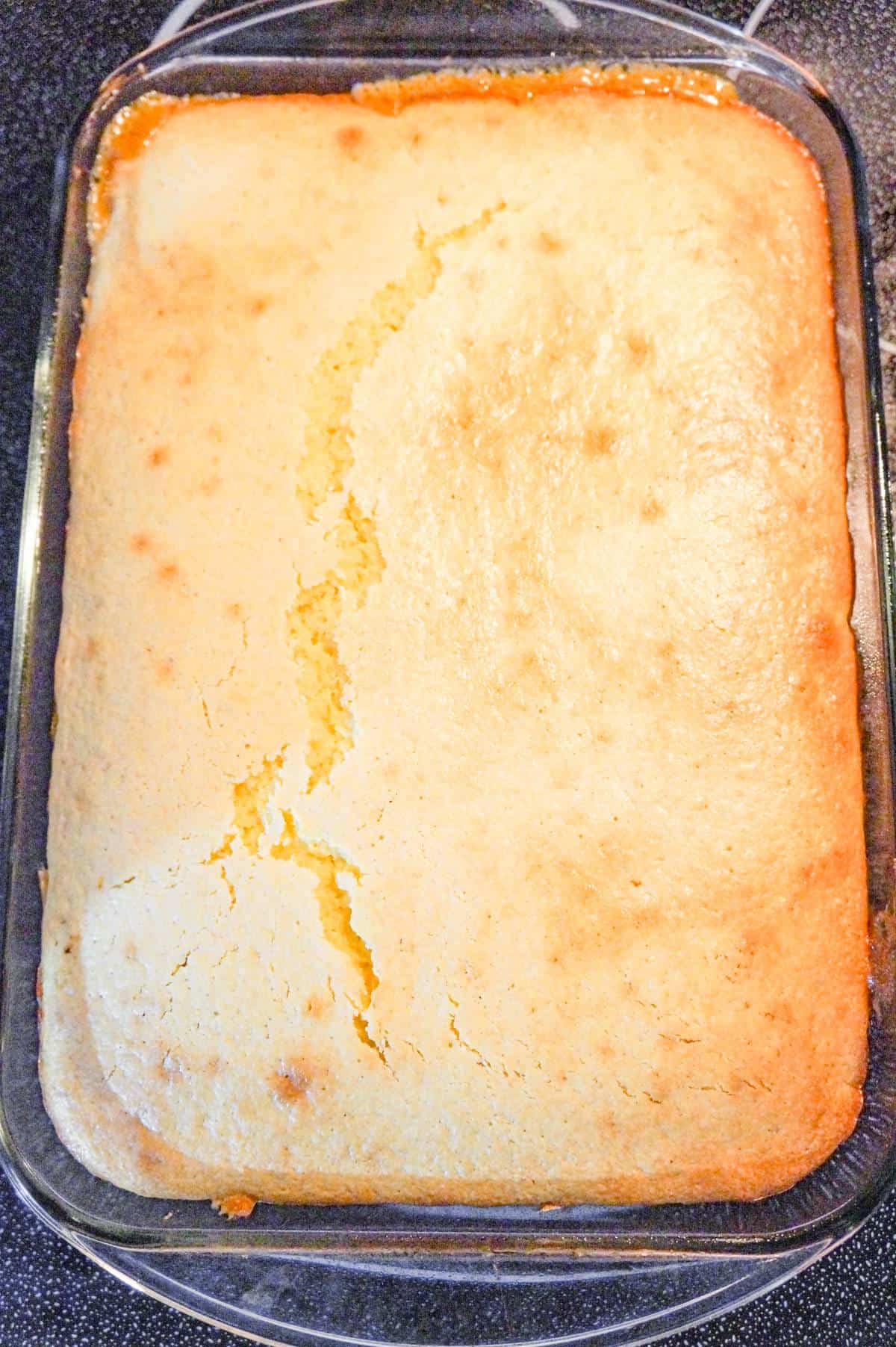 cornbread on top of casserole in a baking dish