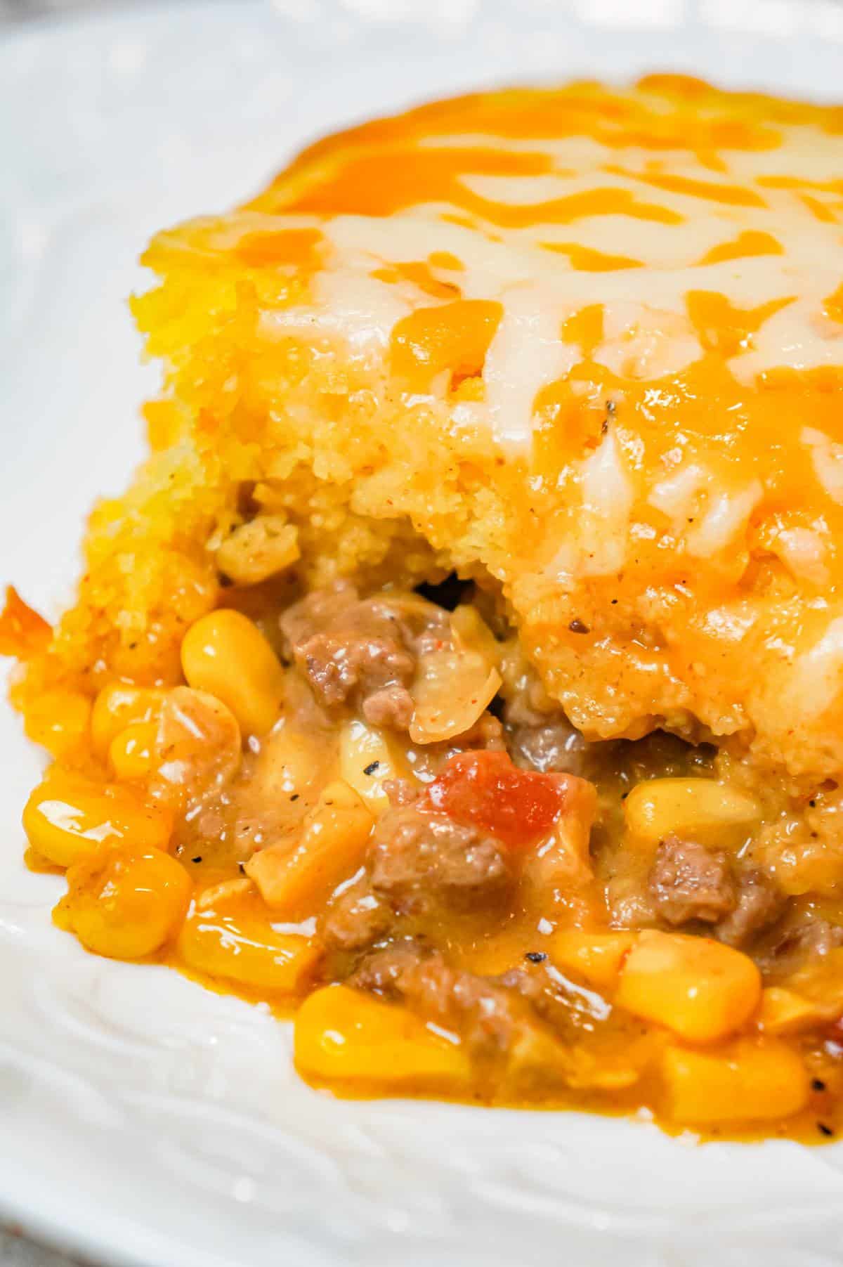 Mexican Cornbread Casserole is an easy ground beef dinner recipe loaded with corn, Rotel diced tomatoes and green chilies, taco seasoning and shredded cheese all topped with Jiffy cornbread.