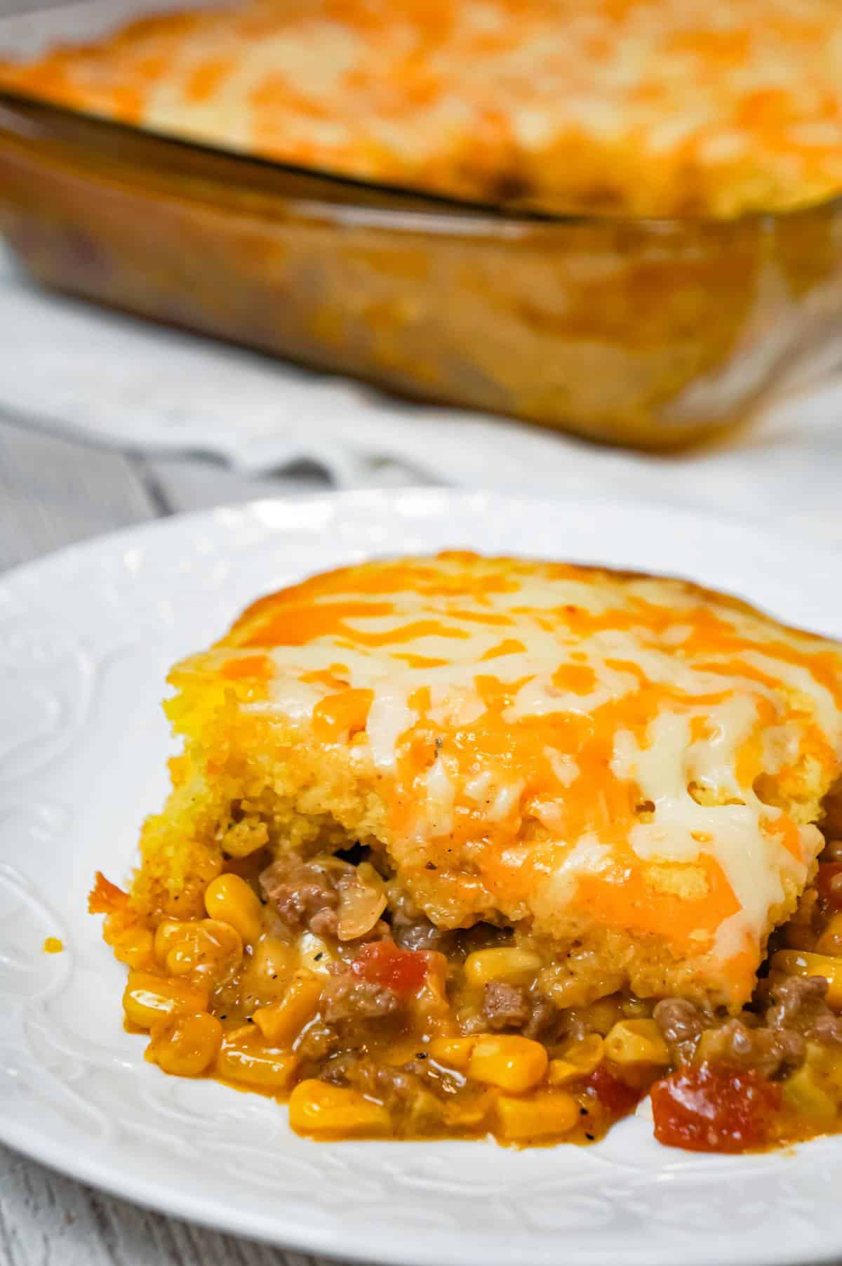 Mexican Cornbread Casserole is an easy ground beef dinner recipe loaded with corn, Rotel diced tomatoes and green chilies, taco seasoning and shredded cheese all topped with Jiffy cornbread.