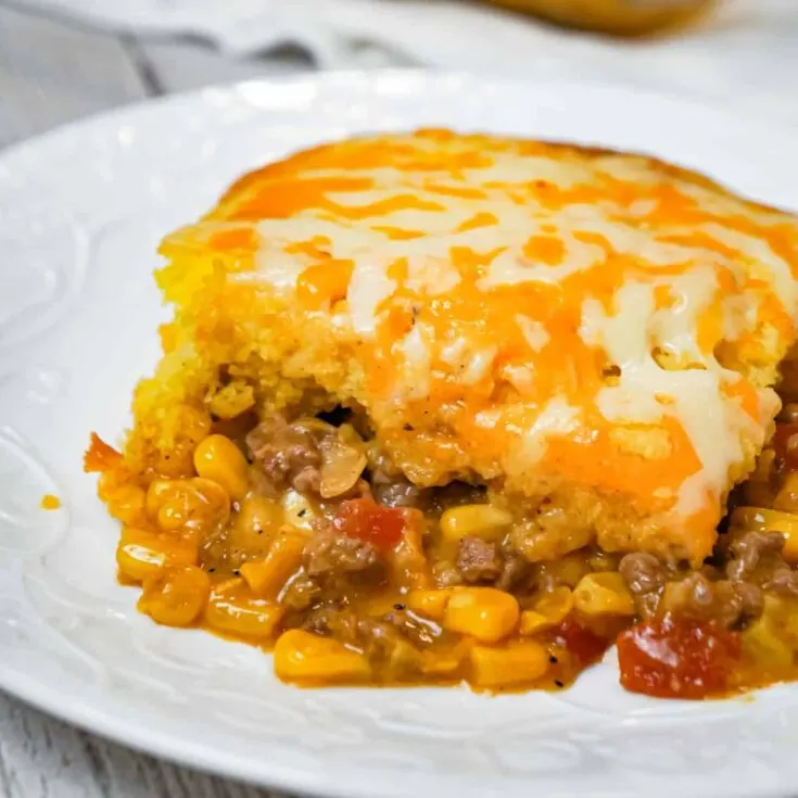 Mexican Cornbread Casserole is an easy ground beef dinner recipe loaded with corn, Rotel diced tomatoes and green chilies, taco seasoning and shredded cheese all topped with Jiffy cornbread.