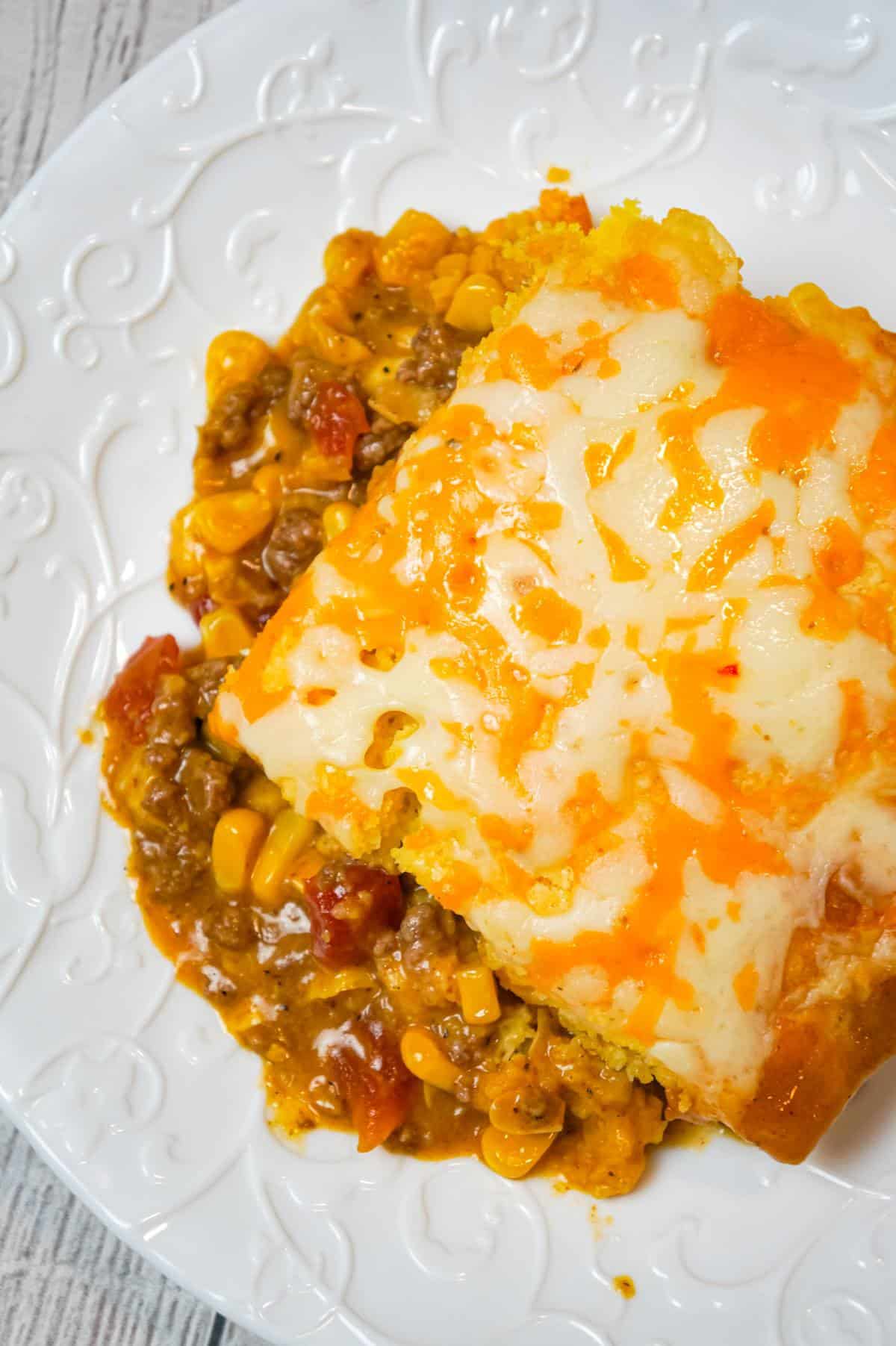 Mexican Cornbread Casserole is an easy ground beef dinner recipe loaded with corn, Rotel diced tomatoes and green chilies, taco seasoning and shredded cheese all topped with Jiffy cornbread.