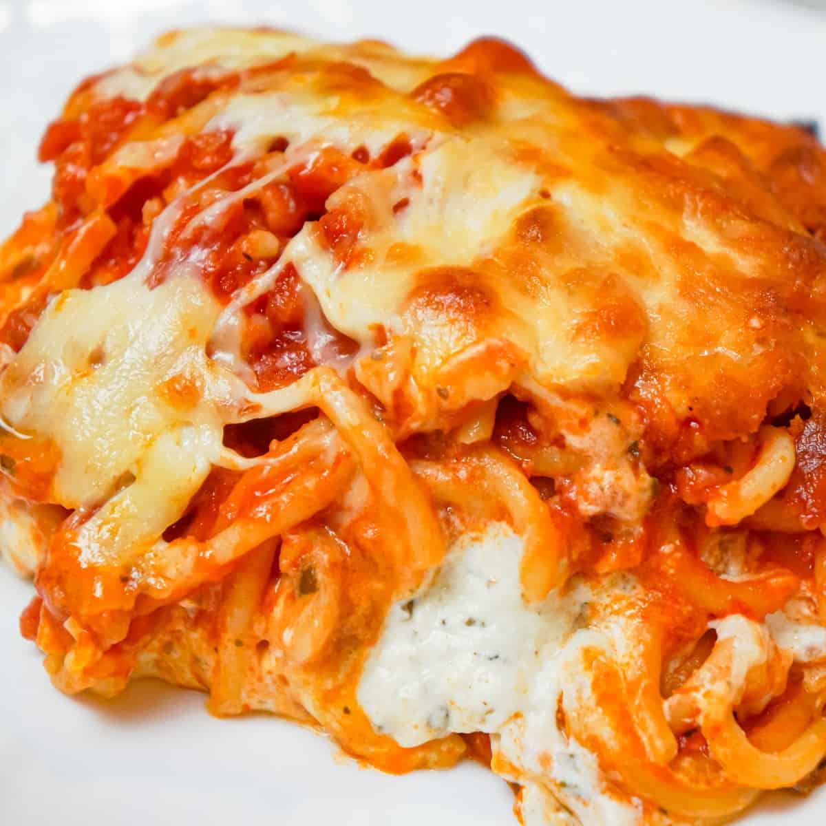 Million Dollar Spaghetti is a delicious baked spaghetti recipe loaded with Italian sausage, cream cheese, sour cream and a blend of shredded Italian cheeses.