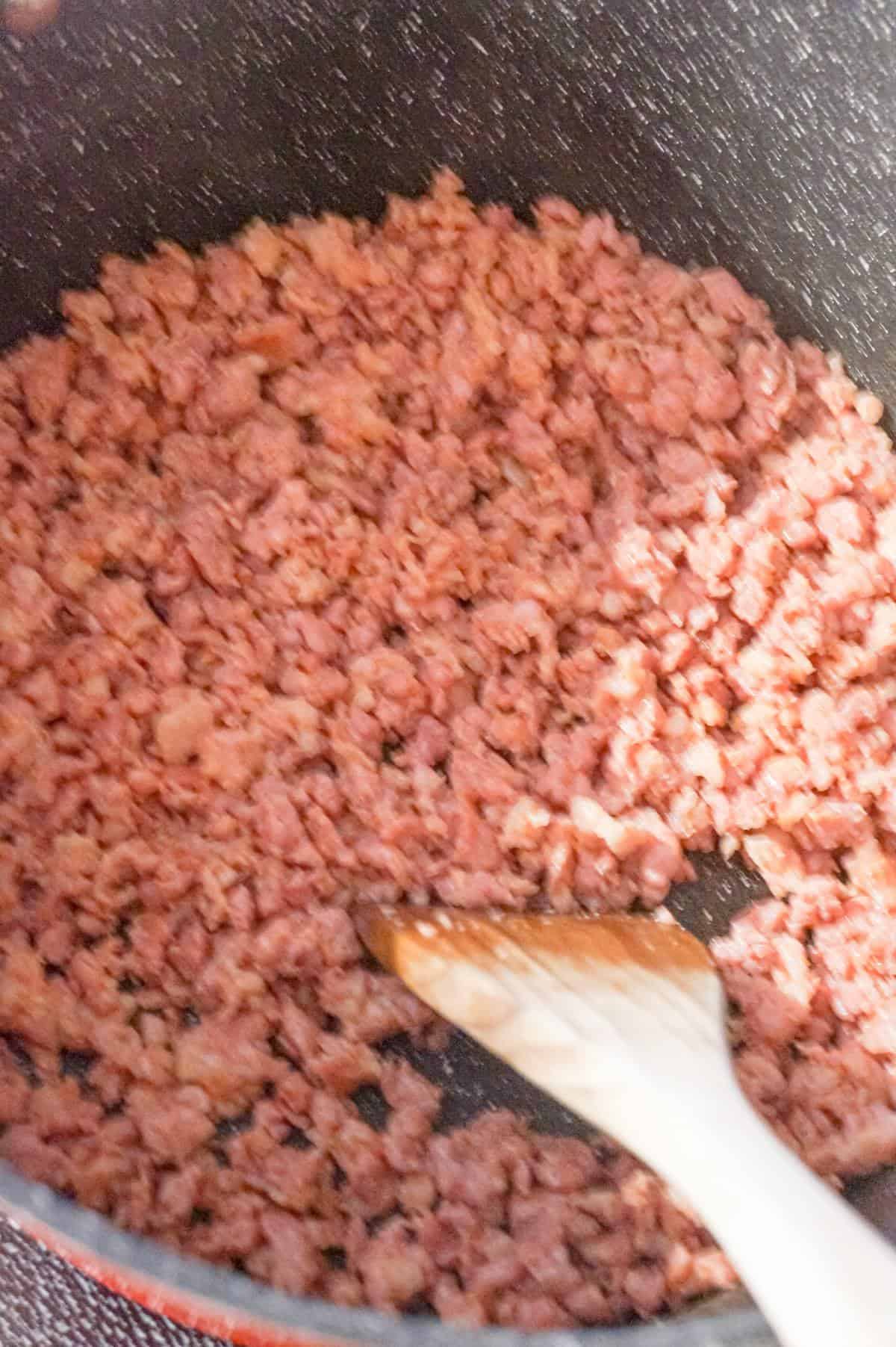 crumbled ground sausage meat in a large pot
