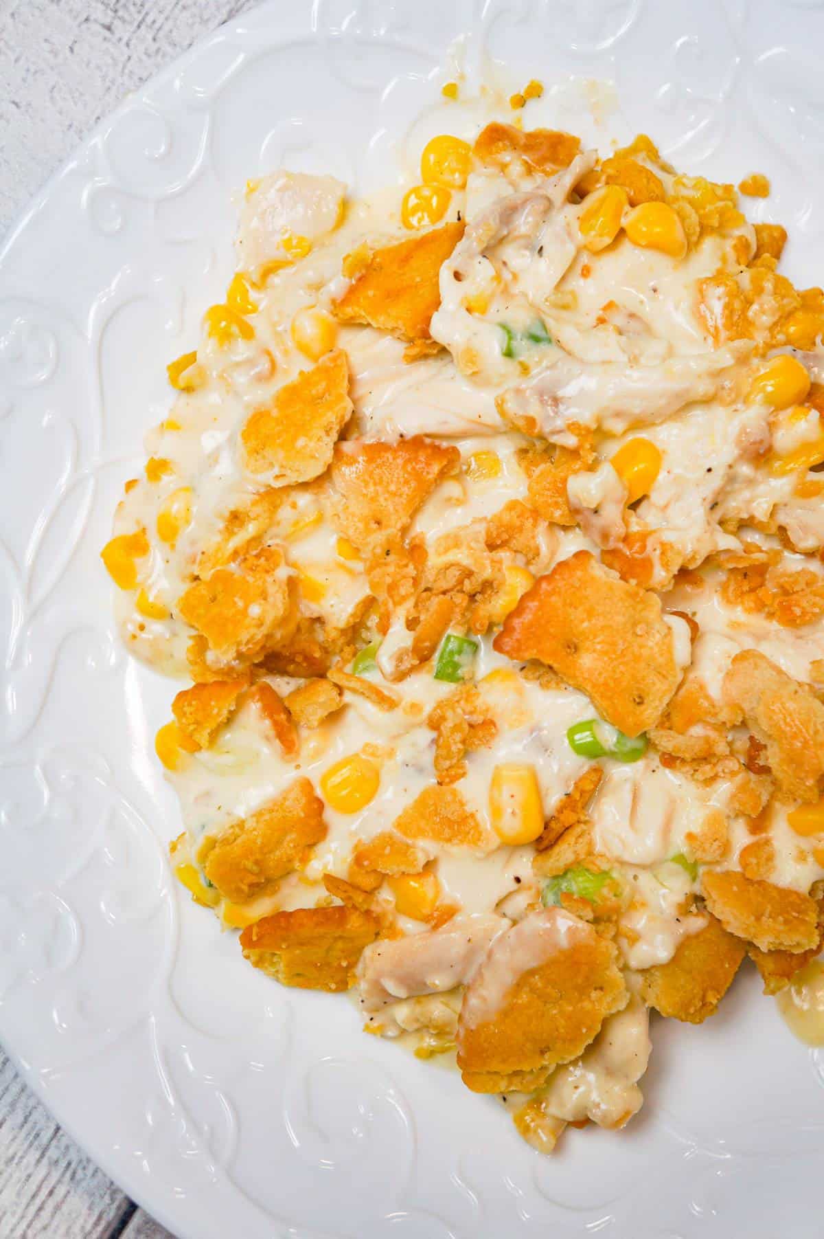 Ritz Chicken Casserole is an easy weeknight dinner recipe using shredded rotisserie chicken, tossed in sour cream and cream of chicken soup and topped with crumbled Ritz crumbs.