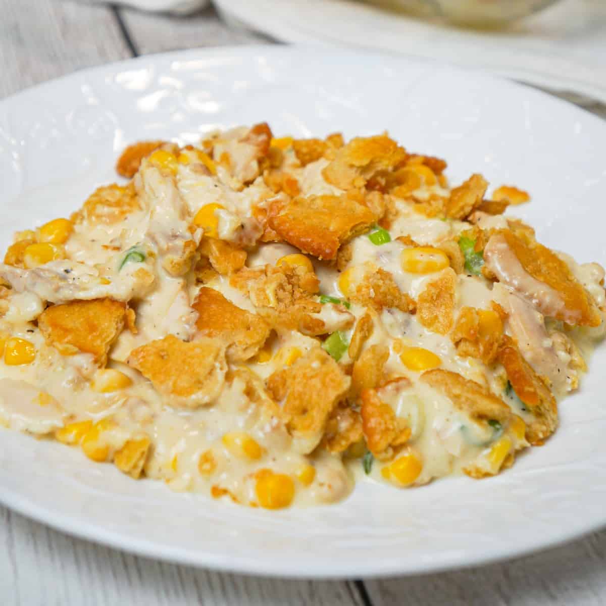 Ritz Chicken Casserole is an easy weeknight dinner recipe using shredded rotisserie chicken, tossed in sour cream and cream of chicken soup and topped with crumbled Ritz crumbs.