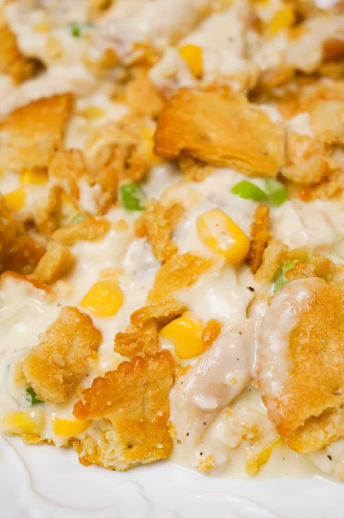 Ritz Chicken Casserole is an easy weeknight dinner recipe using shredded rotisserie chicken, tossed in sour cream and cream of chicken soup and topped with crumbled Ritz crumbs.