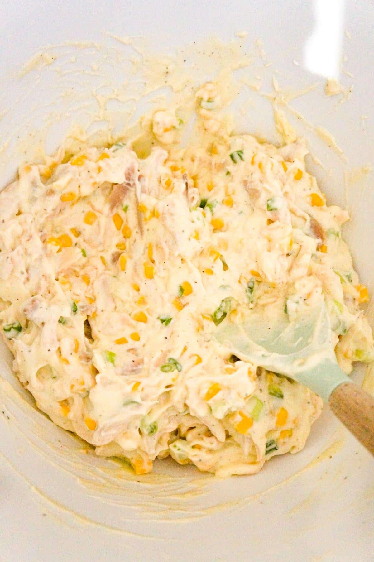 creamy chicken mixture in a mixing bowl
