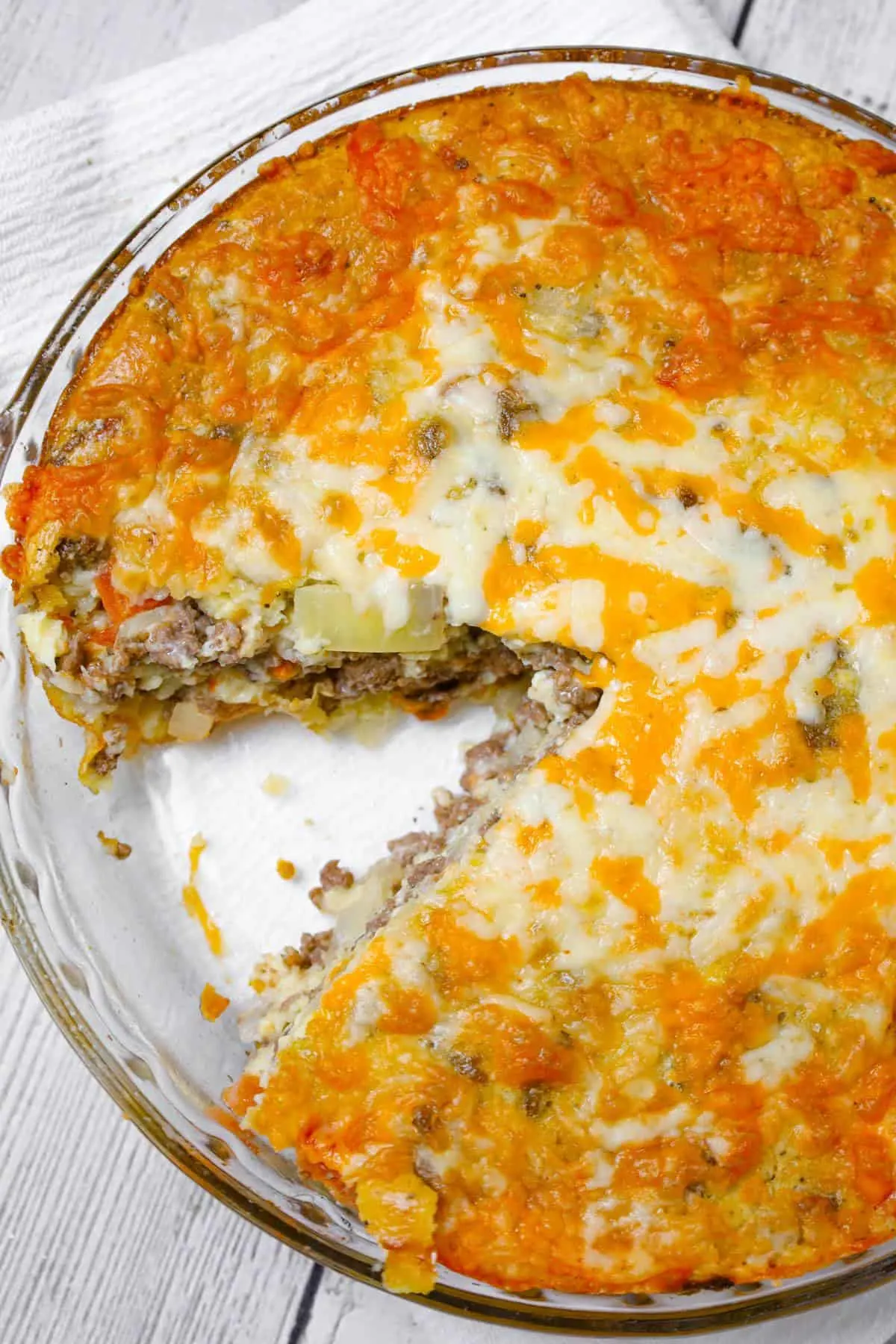Cheeseburger Pie with Bisquick is an easy ground beef dinner recipe loaded with shredded cheese, diced onions and diced tomatoes.