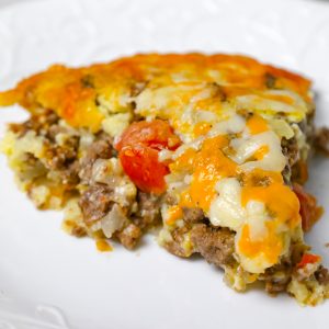 Cheeseburger Pie with Bisquick is an easy ground beef dinner recipe loaded with shredded cheese, diced onions and diced tomatoes.
