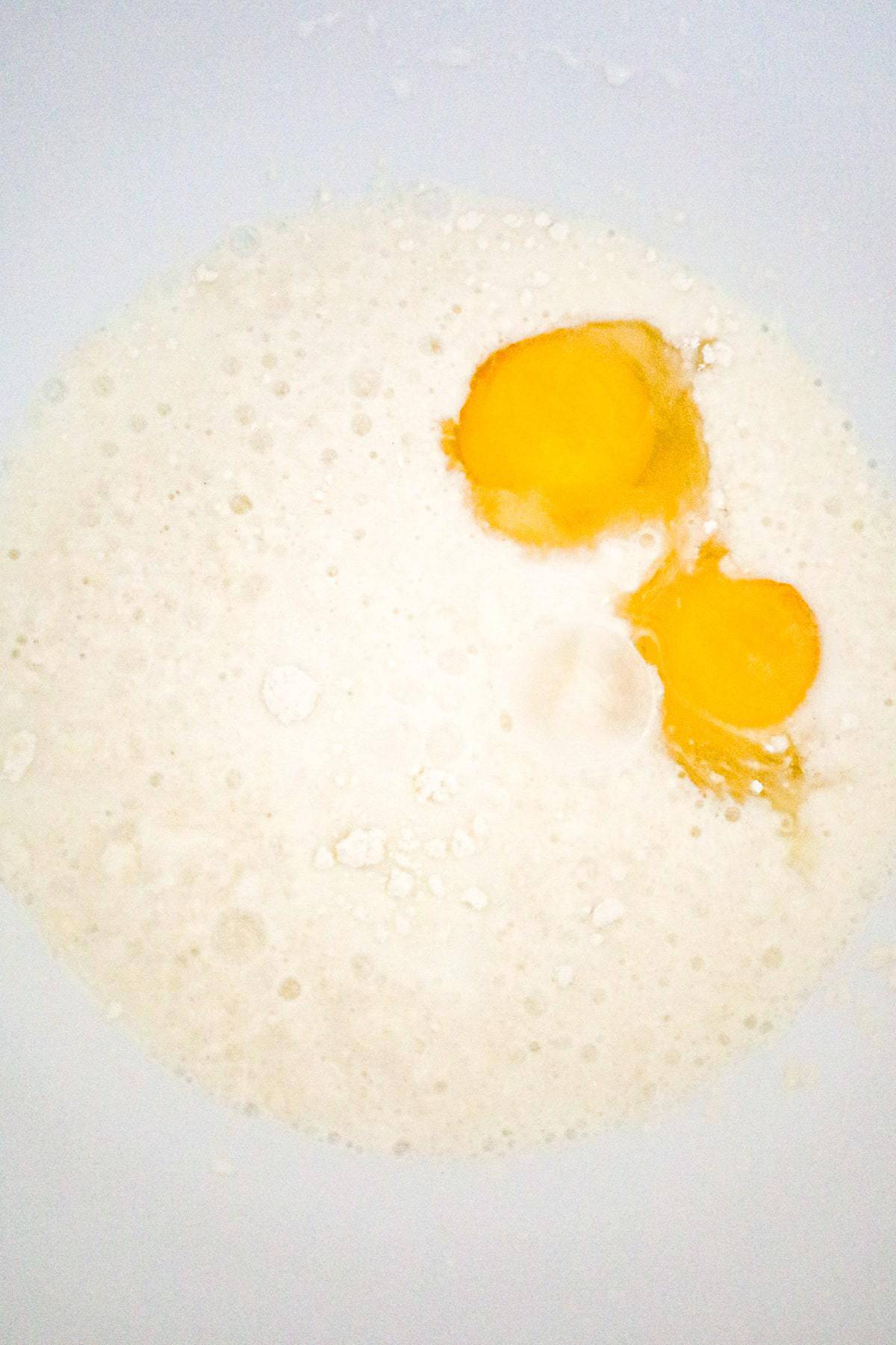 eggs, milk and Bisquick mix in a mixing bowl