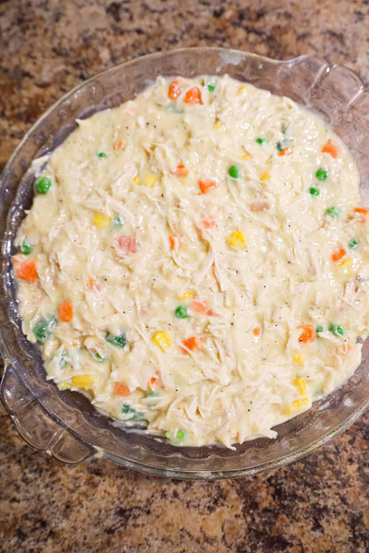 creamy chicken and vegetable mixture in a pie plate