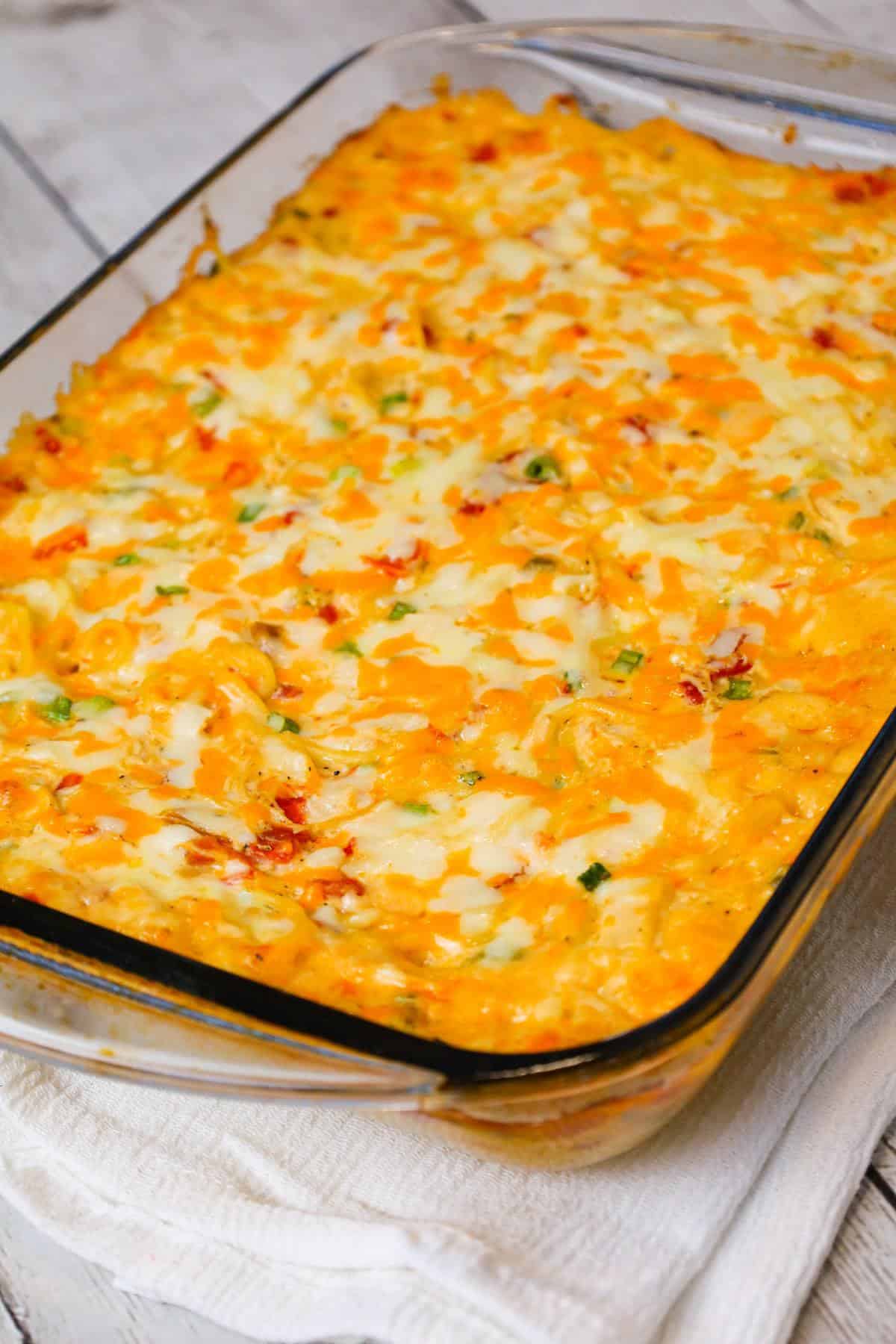 Chicken Spaghetti with Rotel is a delicious baked spaghetti recipe with a creamy sauce loaded with shredded chicken, Rotel diced tomatoes and green chilies, shredded cheese and chopped green onions.