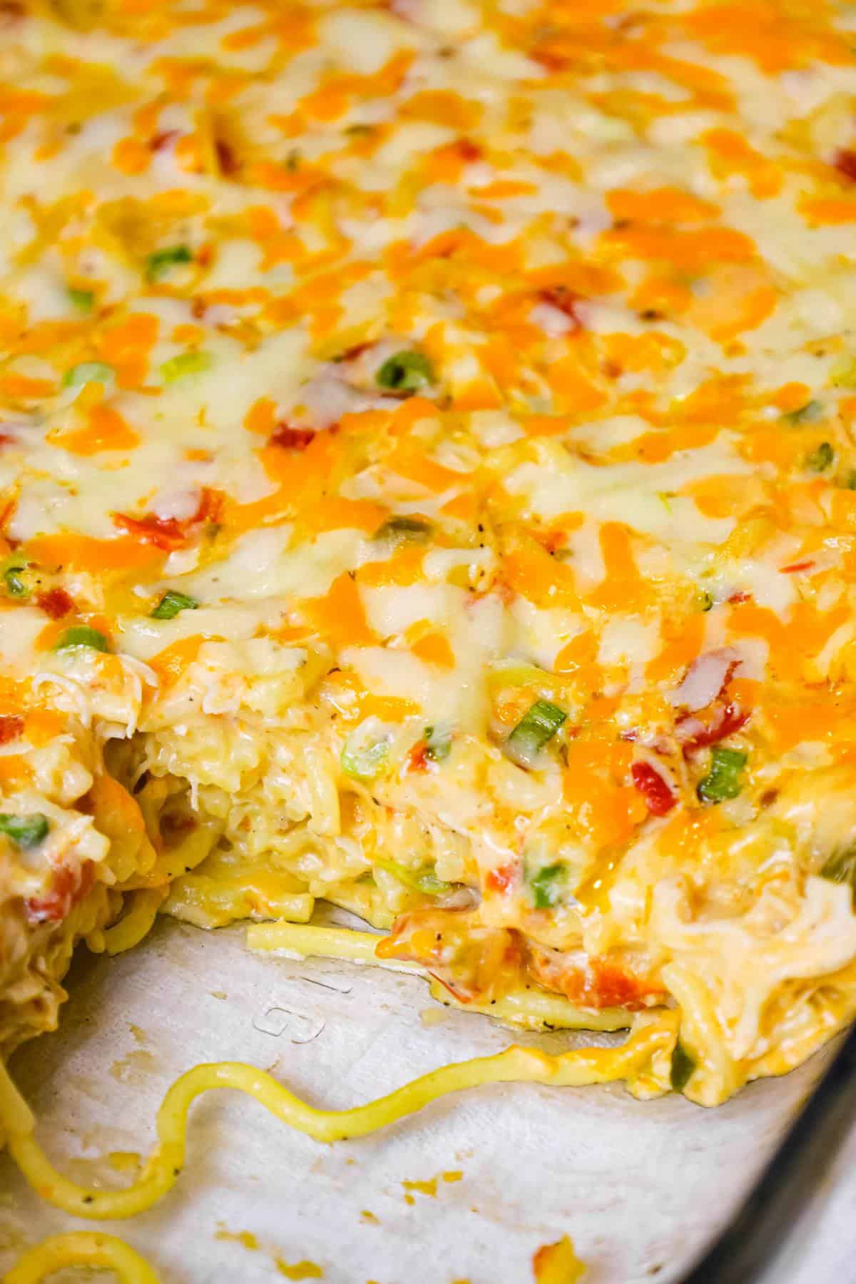 Chicken Spaghetti with Rotel is a delicious baked spaghetti recipe with a creamy sauce loaded with shredded chicken, Rotel diced tomatoes and green chilies, shredded cheese and chopped green onions.