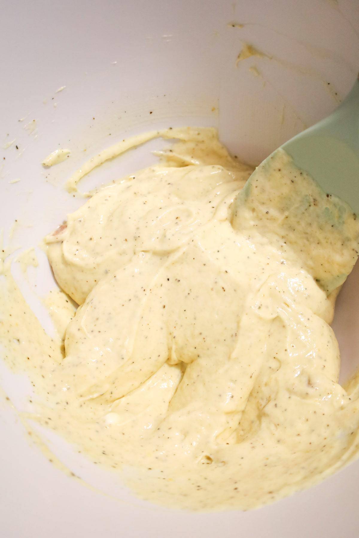 sour cream and condensed cream of chicken soup mixture in a mixing bowl