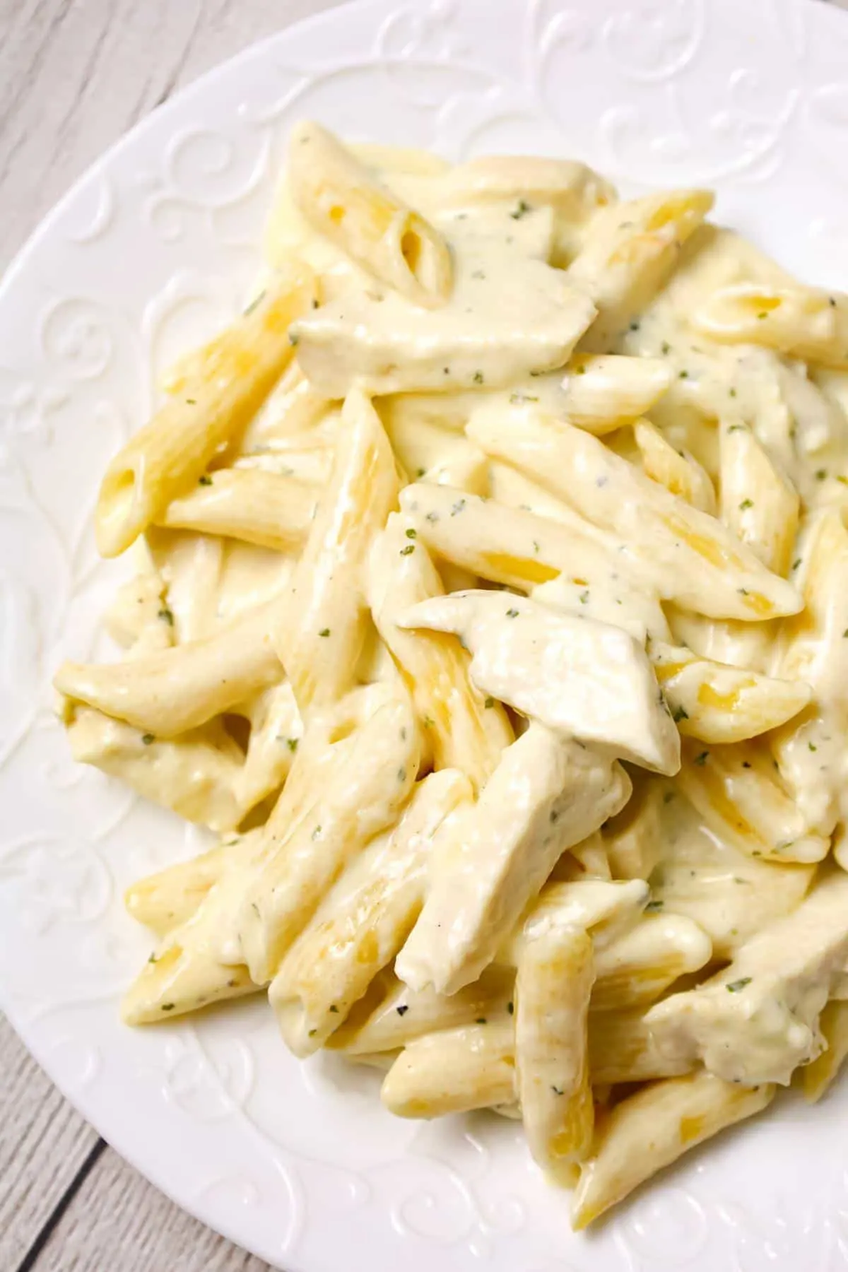Crock Pot Chicken Alfredo is a delicious slow cooker penne pasta recipe loaded with chunks boneless, skinless chicken breasts and all tossed in a creamy garlic and parmesan sauce.