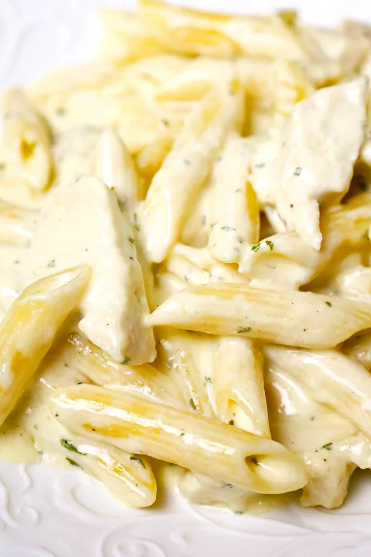 Crock Pot Chicken Alfredo is a delicious slow cooker penne pasta recipe loaded with chunks boneless, skinless chicken breasts and all tossed in a creamy garlic and parmesan sauce.