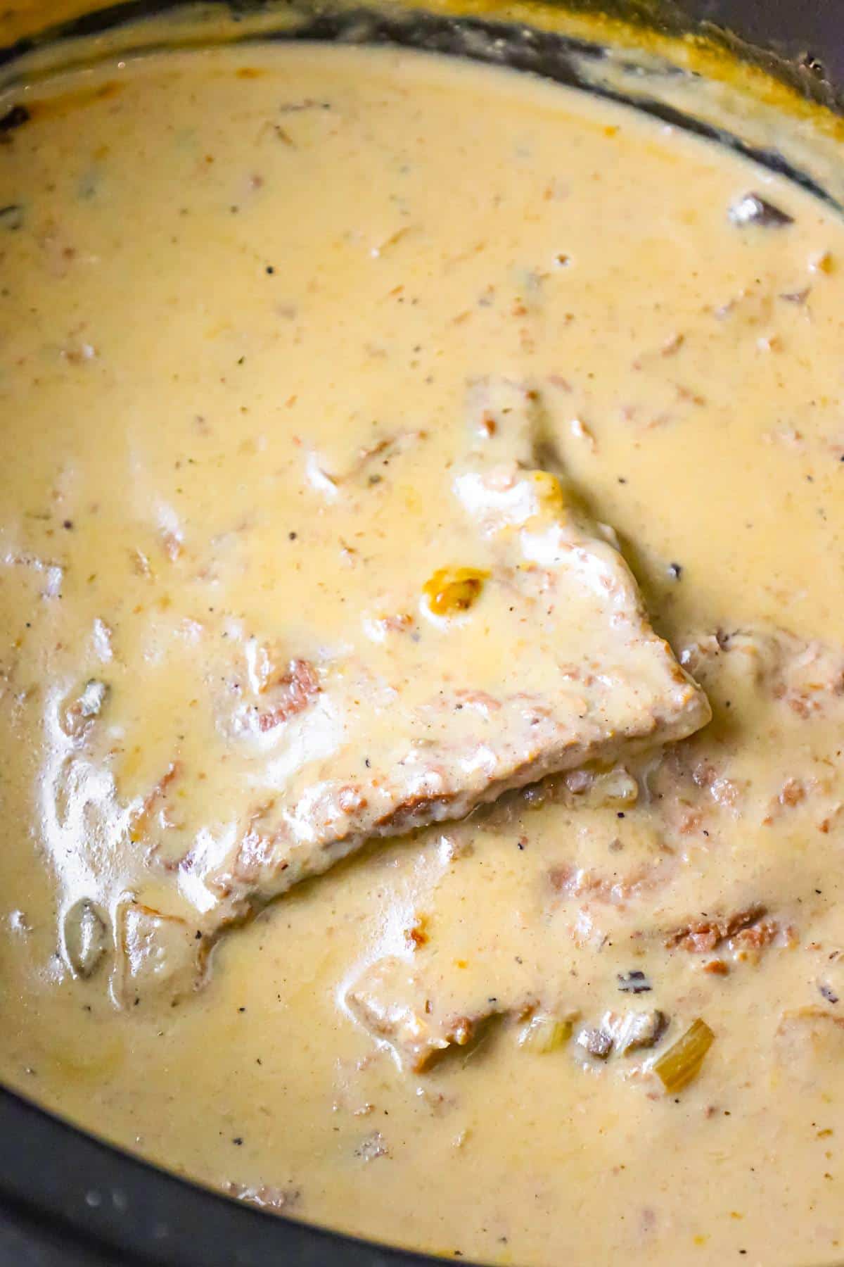 Crock Pot Cube Steak is an easy dinner recipe of tenderized steak cooked in a creamy mushroom gravy sauce.