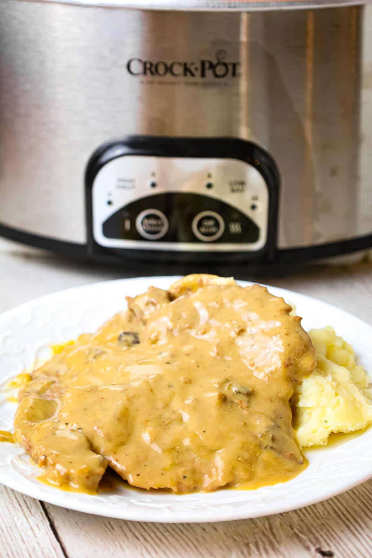 Crock Pot Cube Steak is an easy dinner recipe of tenderized steak cooked in a creamy mushroom gravy sauce.