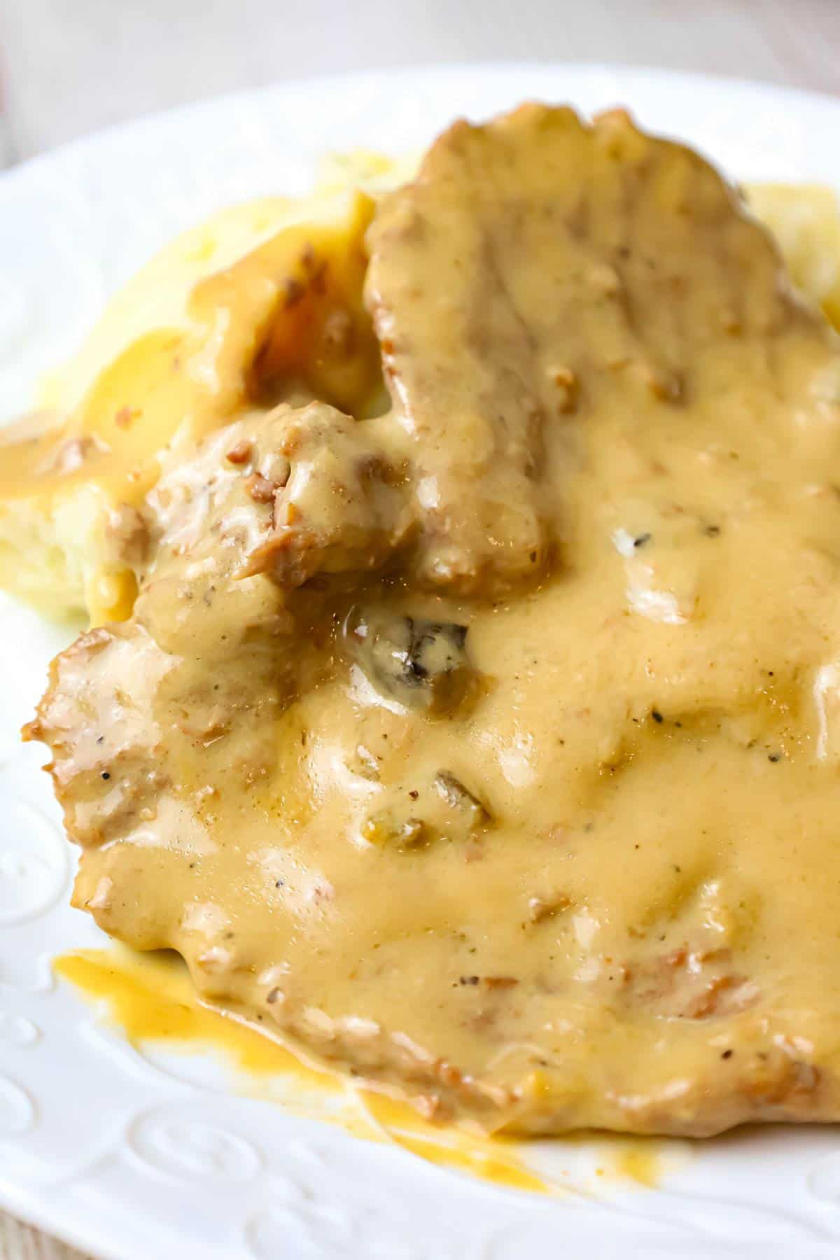 Crock Pot Cube Steak is an easy dinner recipe of tenderized steak cooked in a creamy mushroom gravy sauce.