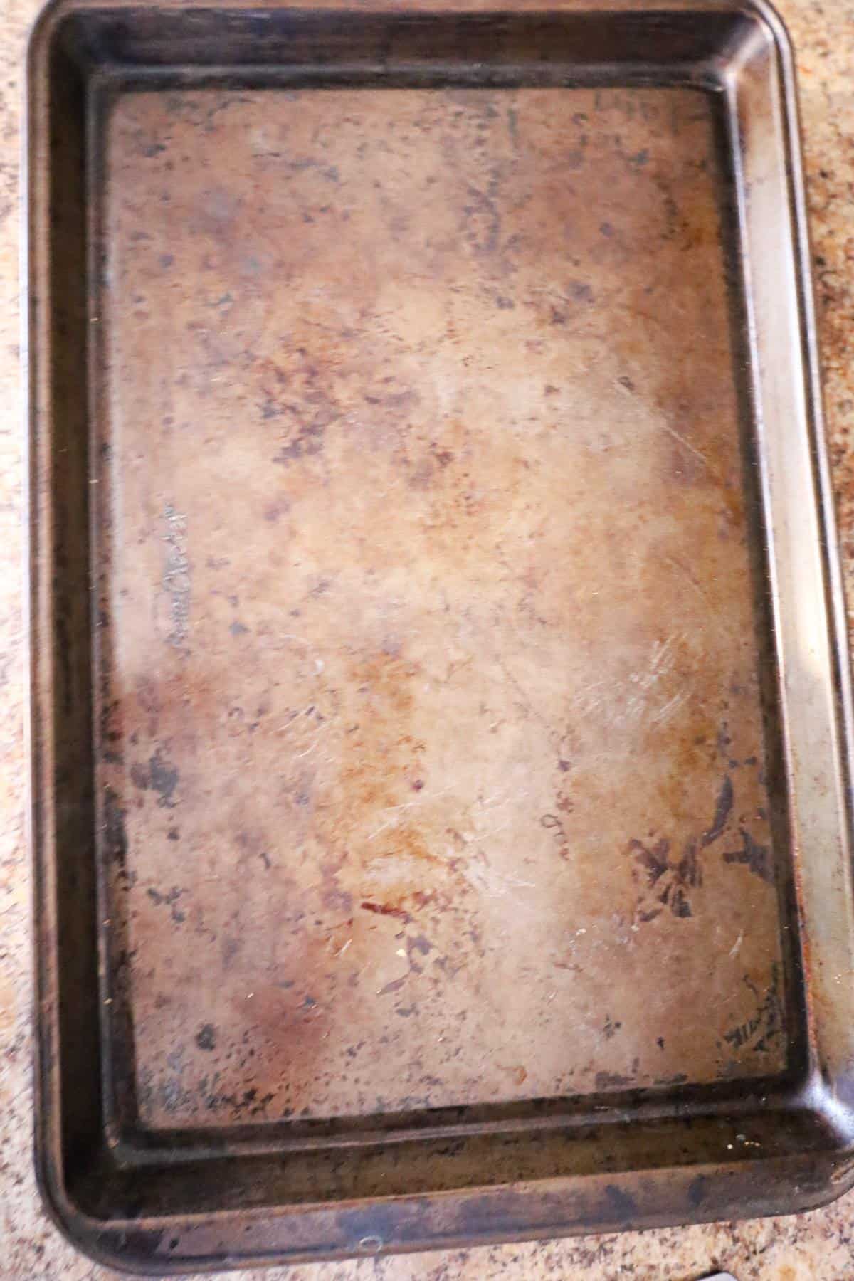 baking sheet on top of French bread loaf halves