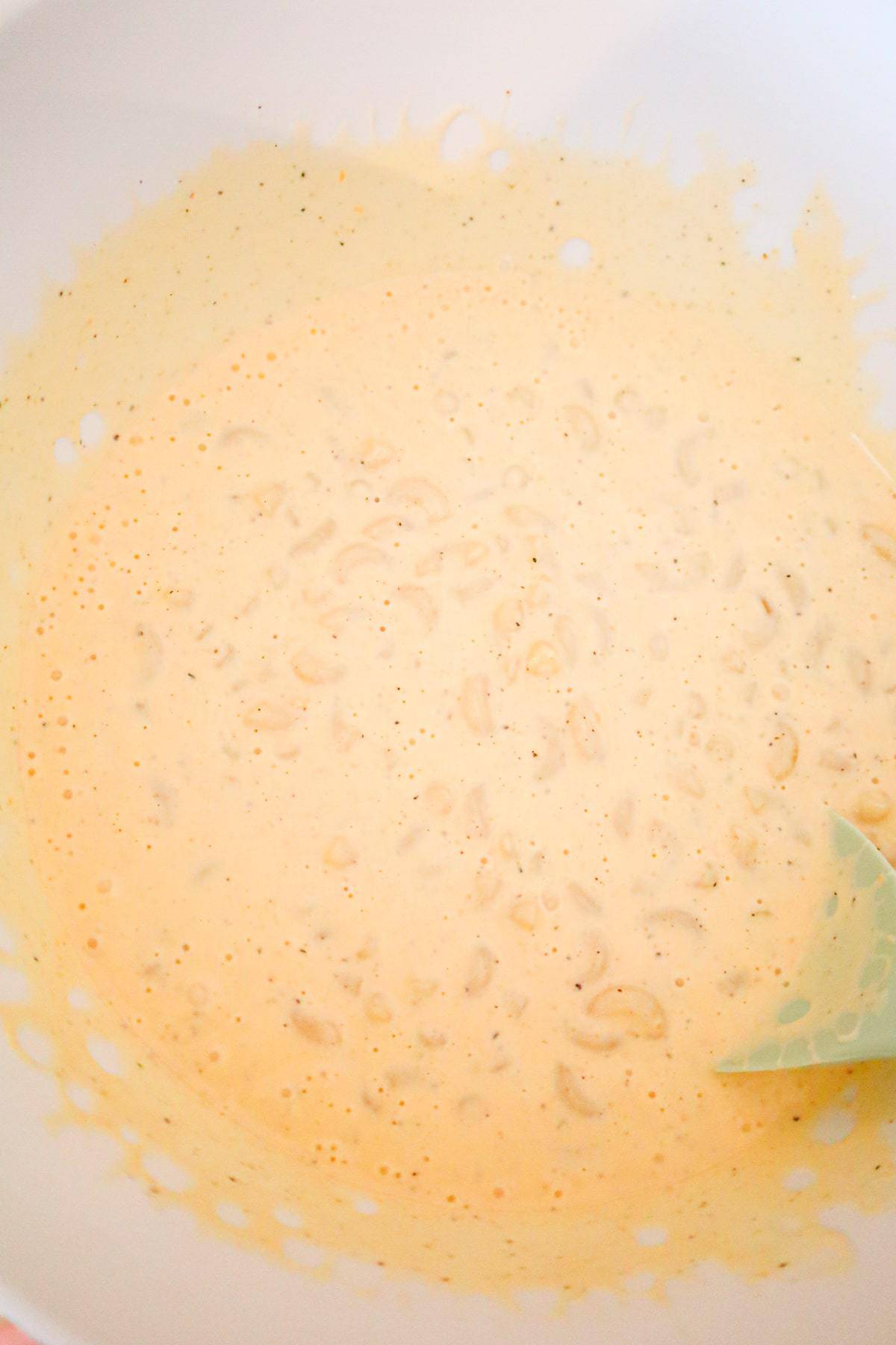 creamy macaroni mixture in a mixing bowl