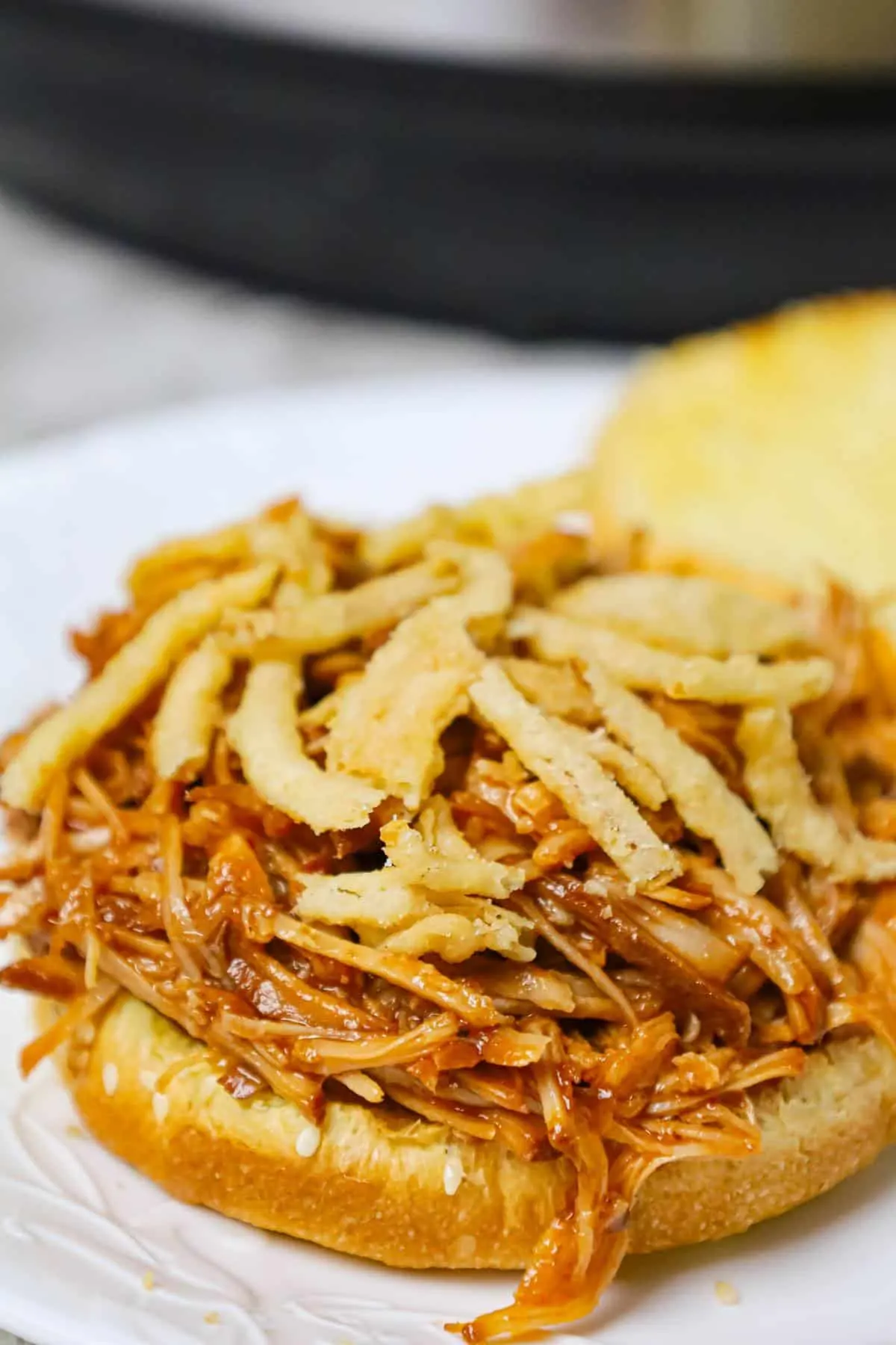 Instant Pot Pulled Pork is an easy and delicious dinner made with a boneless pork roast pressure cooked in apple juice and BBQ sauce.