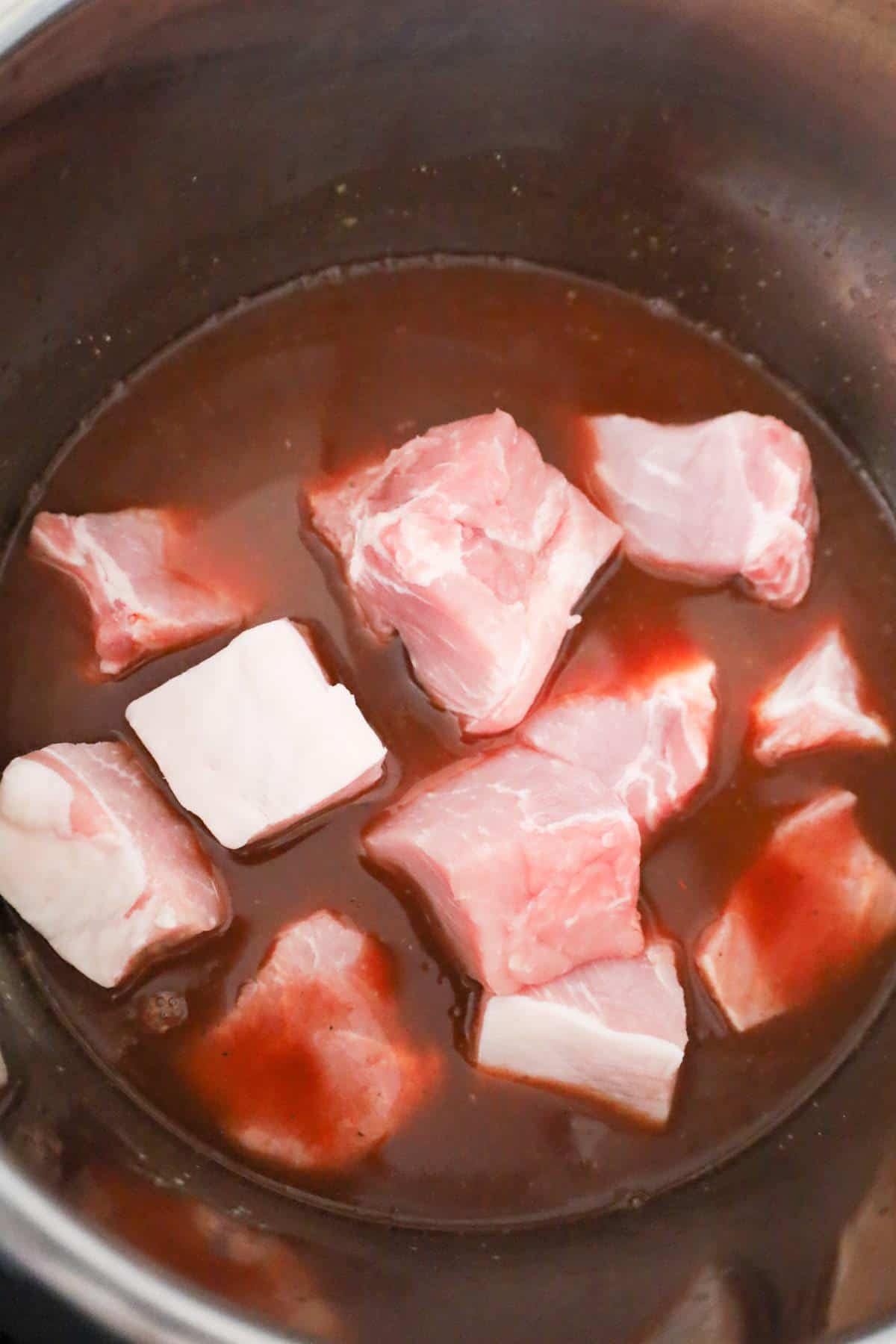 raw pork roast chunks in an Instant Pot