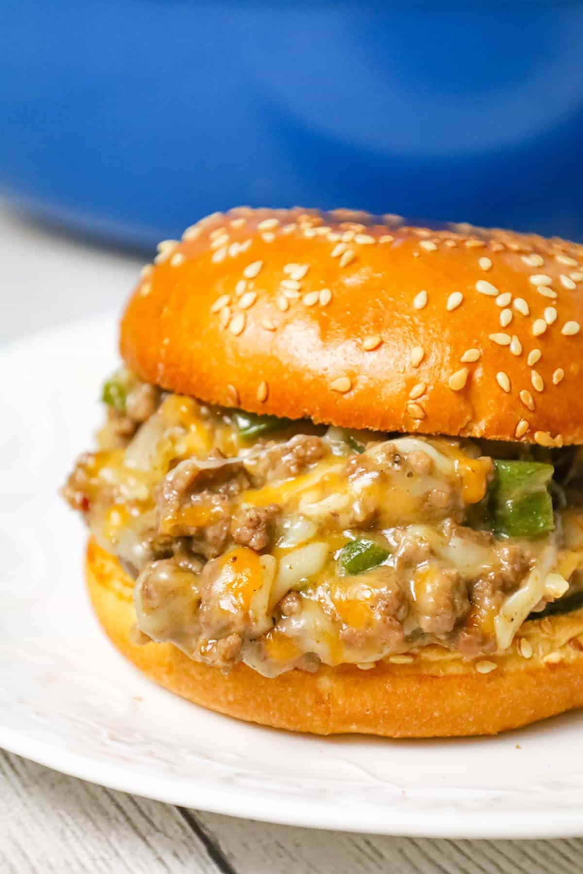 Philly Cheese Steak Sloppy Joes are an weeknight dinner recipe using ground beef loaded with green peppers, onions and shredded cheese all served on toasted Brioche buns.