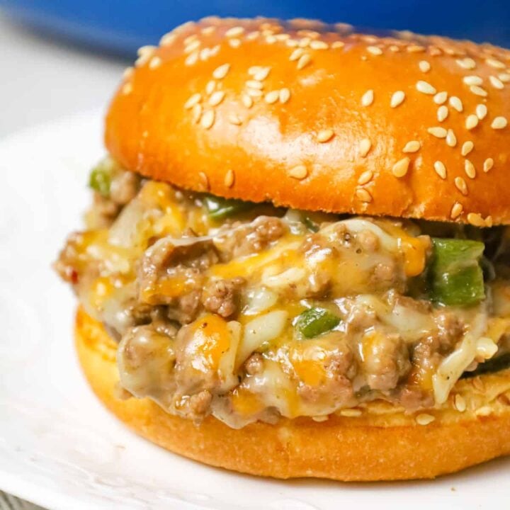 Philly Cheese Steak Sloppy Joes are an weeknight dinner recipe using ground beef loaded with green peppers, onions and shredded cheese all served on toasted Brioche buns.