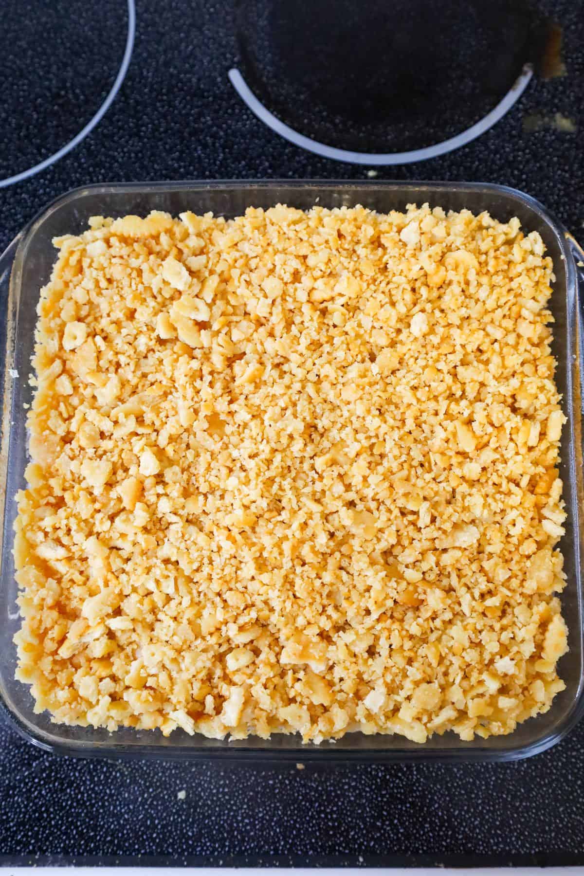crumbled Ritz crackers on top of pineapple casserole before baking