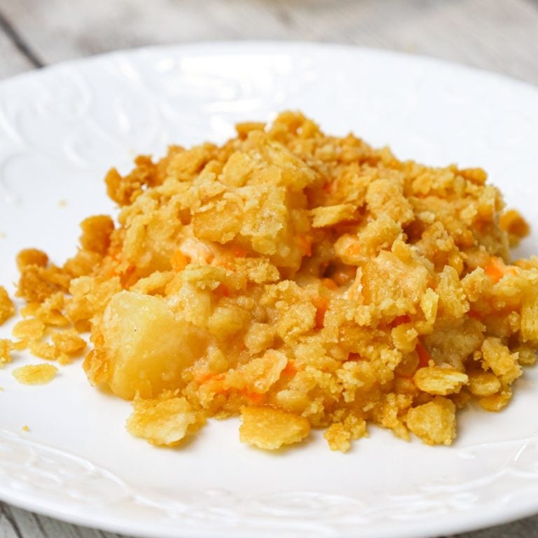 Pineapple Casserole is a sweet and savoury side dish recipe loaded with pineapple chunks, cheddar cheese and Ritz cracker crumbs.