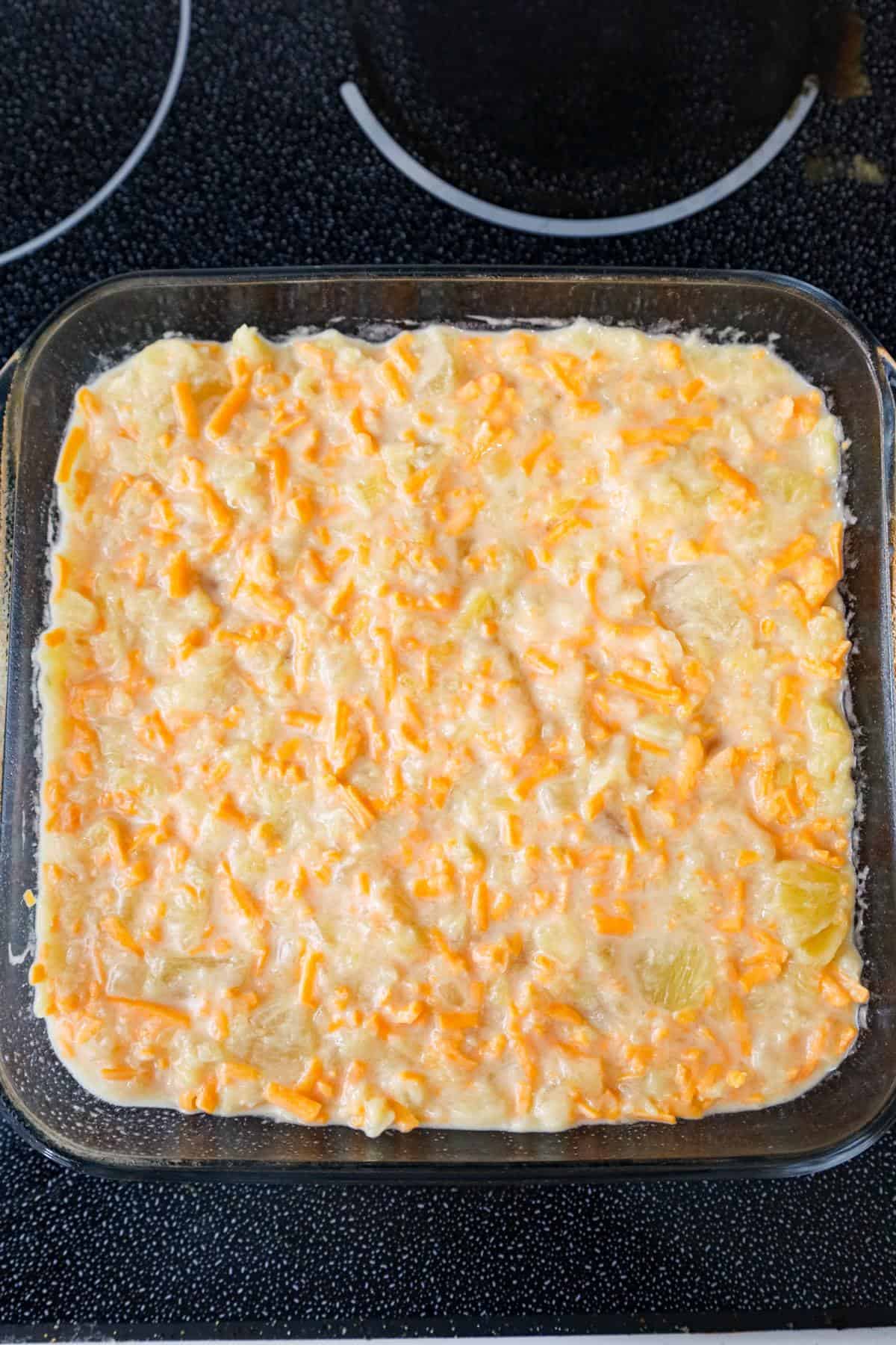 pineapple and cheese mixture in a baking dish