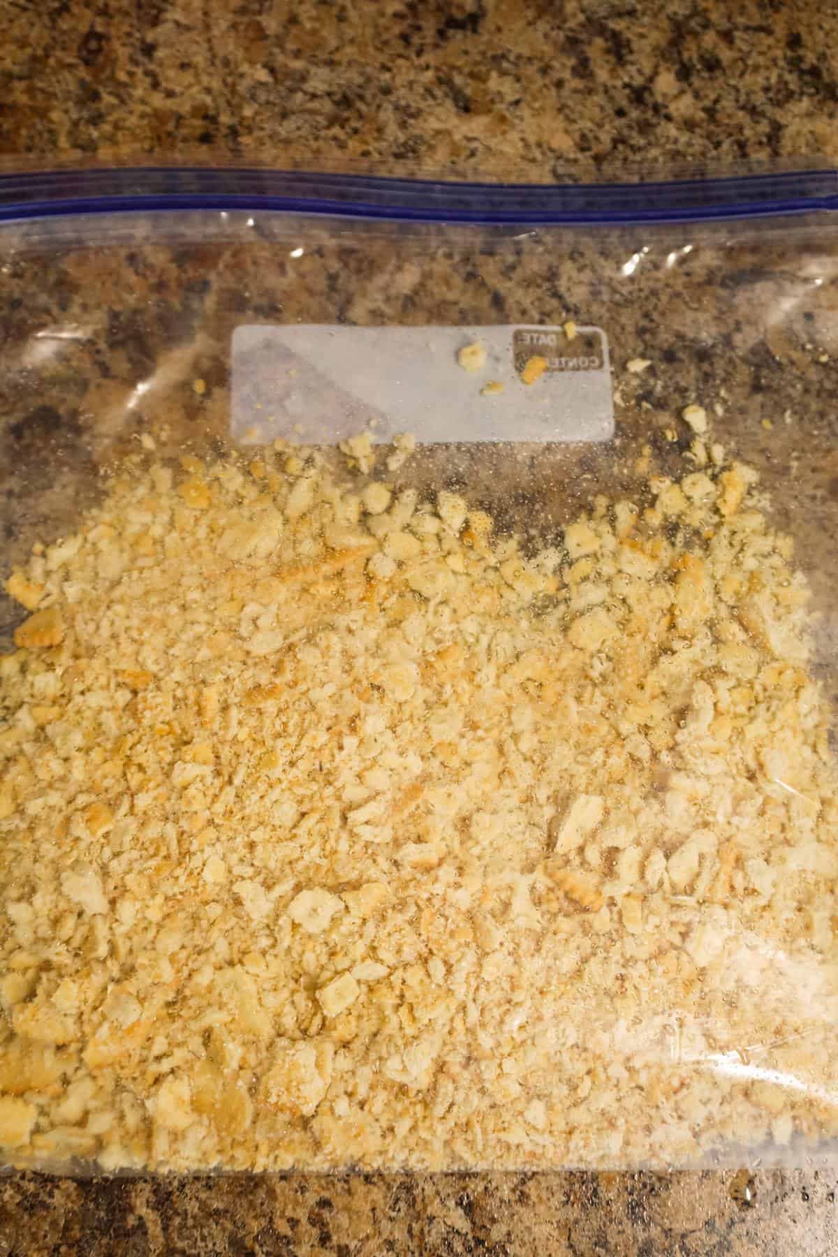Ritz cracker crumbs in a Ziploc bag