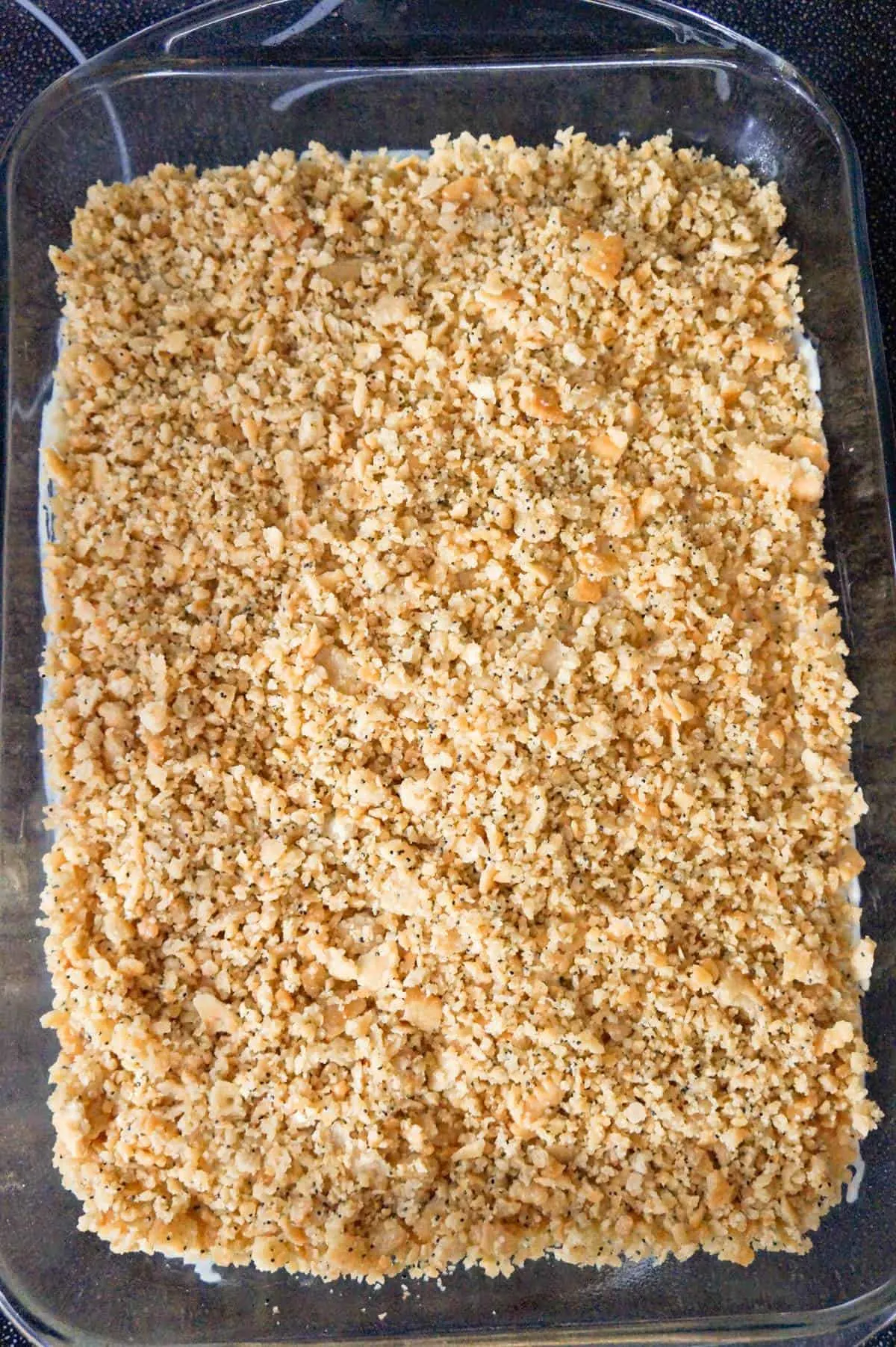 crumbled Ritz crackers on top of casserole in a baking dish