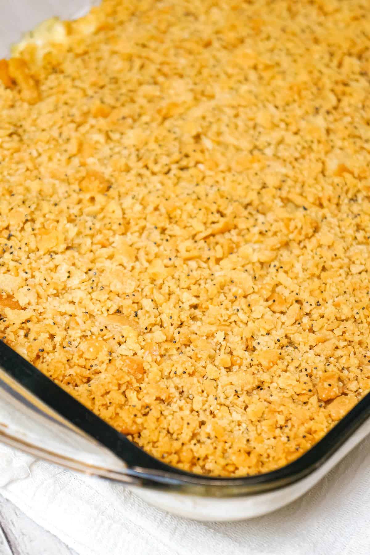 Poppy Seed Chicken Casserole is an easy dinner recipe loaded with shredded chicken, cream of chicken soup, shredded cheese and poppy seeds and topped with crumbled Ritz crackers.