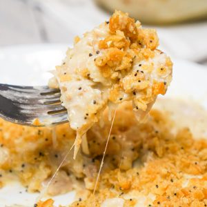 Poppy Seed Chicken Casserole is an easy dinner recipe loaded with shredded chicken, cream of chicken soup, shredded cheese and poppy seeds and topped with crumbled Ritz crackers.