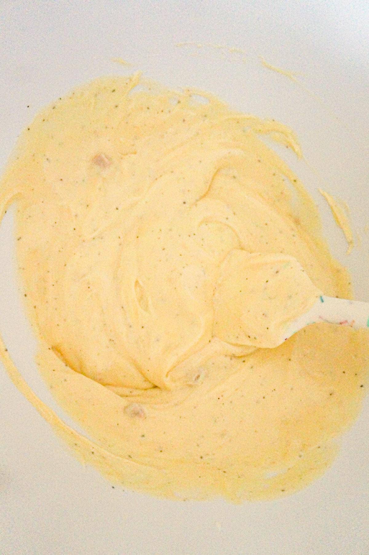 cream of chicken soup and sour cream mixture in a mixing bowl