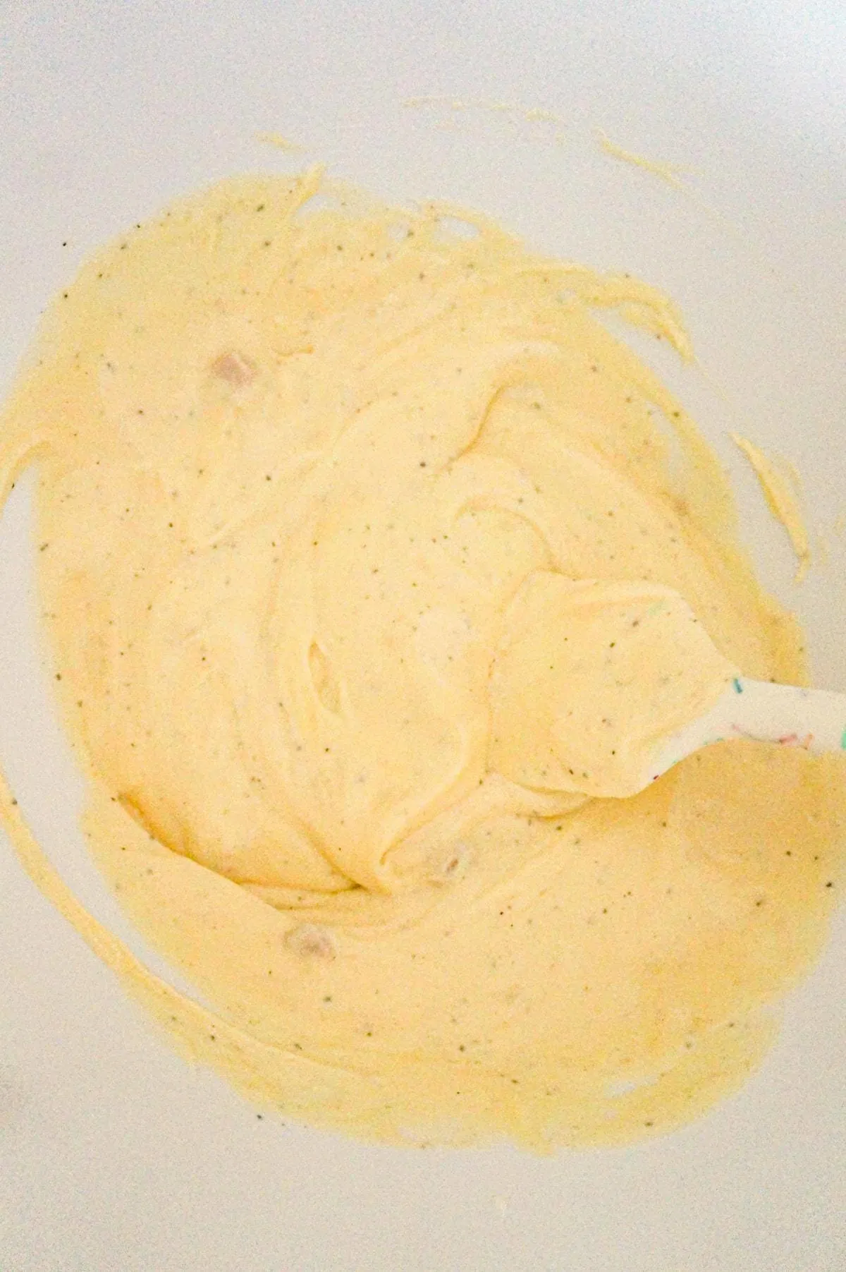 cream of chicken soup and sour cream mixture in a mixing bowl