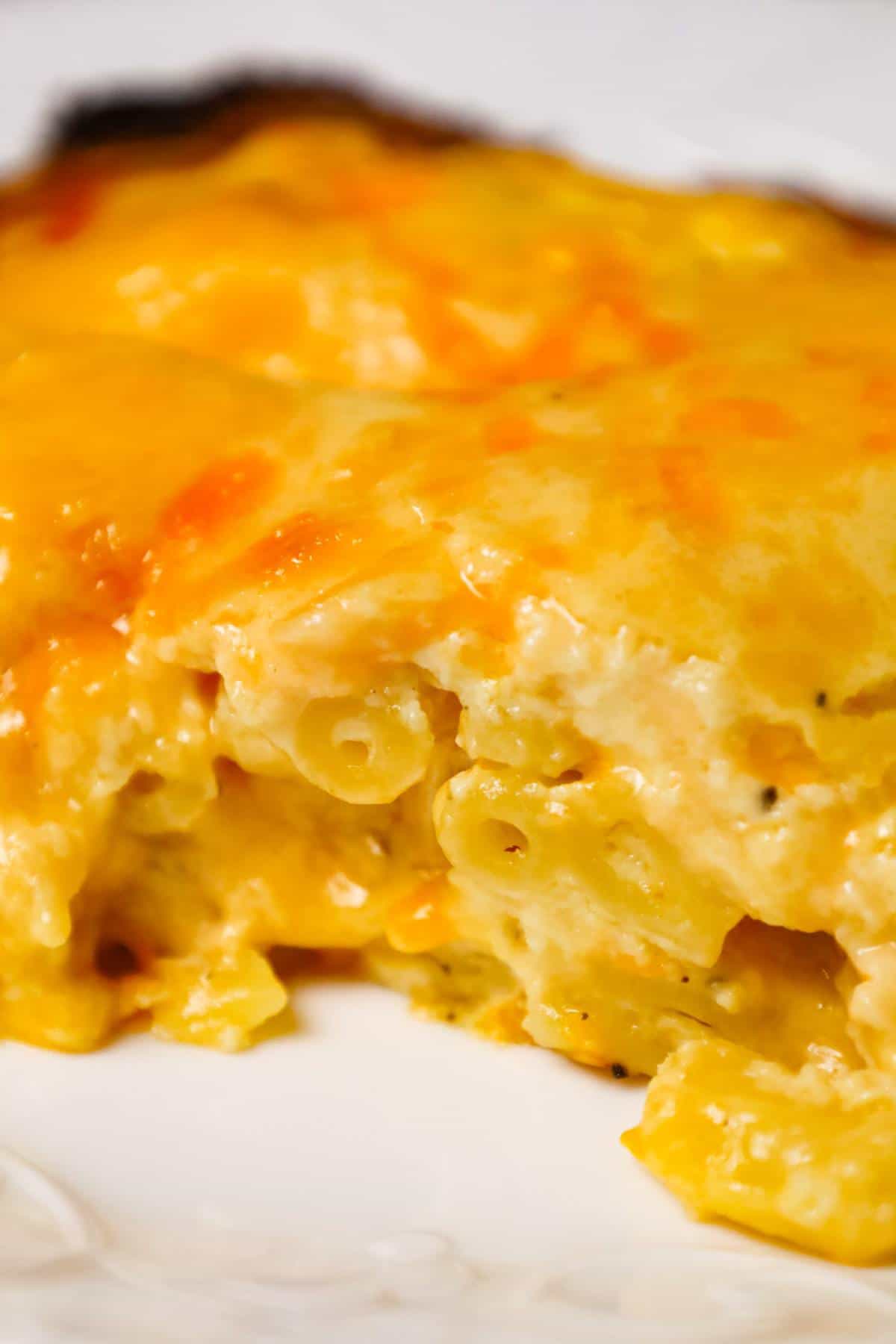 Southern Baked Mac and Cheese is a hearty dinner or side dish recipe loaded with cheddar cheese, Monterey jack and Velveeta.