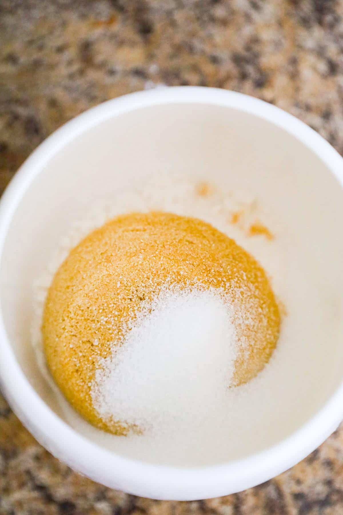 granulated sugar, light brown sugar and all purpose flour in a mug